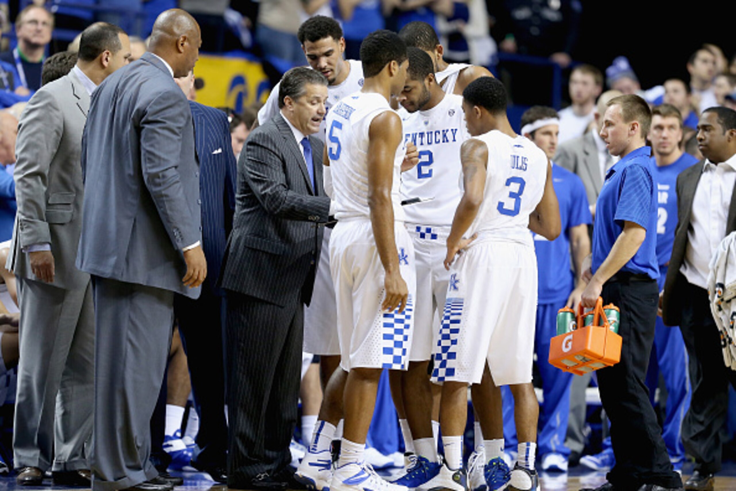 LEXINGTON, KY - DECEMBER 13:  John Calipari the head coach of the Kentucky Wildcats gives instructions to his team during the game against the North Carolina Tar Heels at Rupp Arena on December 13, 2014 in Lexington, Kentucky.  (Photo by Andy Lyons/Getty 