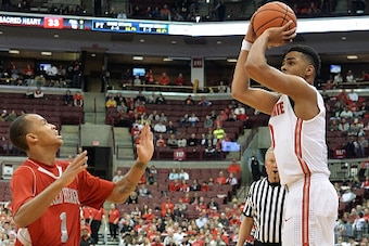 COLUMBUS, OH - NOVEMBER 23:  D'Angelo Russell #0 of the Ohio State Buckeyes shoots a three-point shot over Cane Broome #1 of the Sacred Heart Pioneers in the second half for three of his game high 32 points on November 23, 2014 at Value City Arena in Colu