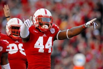 LINCOLN, NE - NOVEMBER 16: Defensive end Randy Gregory #44 of the Nebraska Cornhuskers reacts after a tackle during their game at against the Michigan State Spartans Memorial Stadium on November 16, 2013 in Lincoln, Nebraska. (Photo by Eric Francis/Getty 
