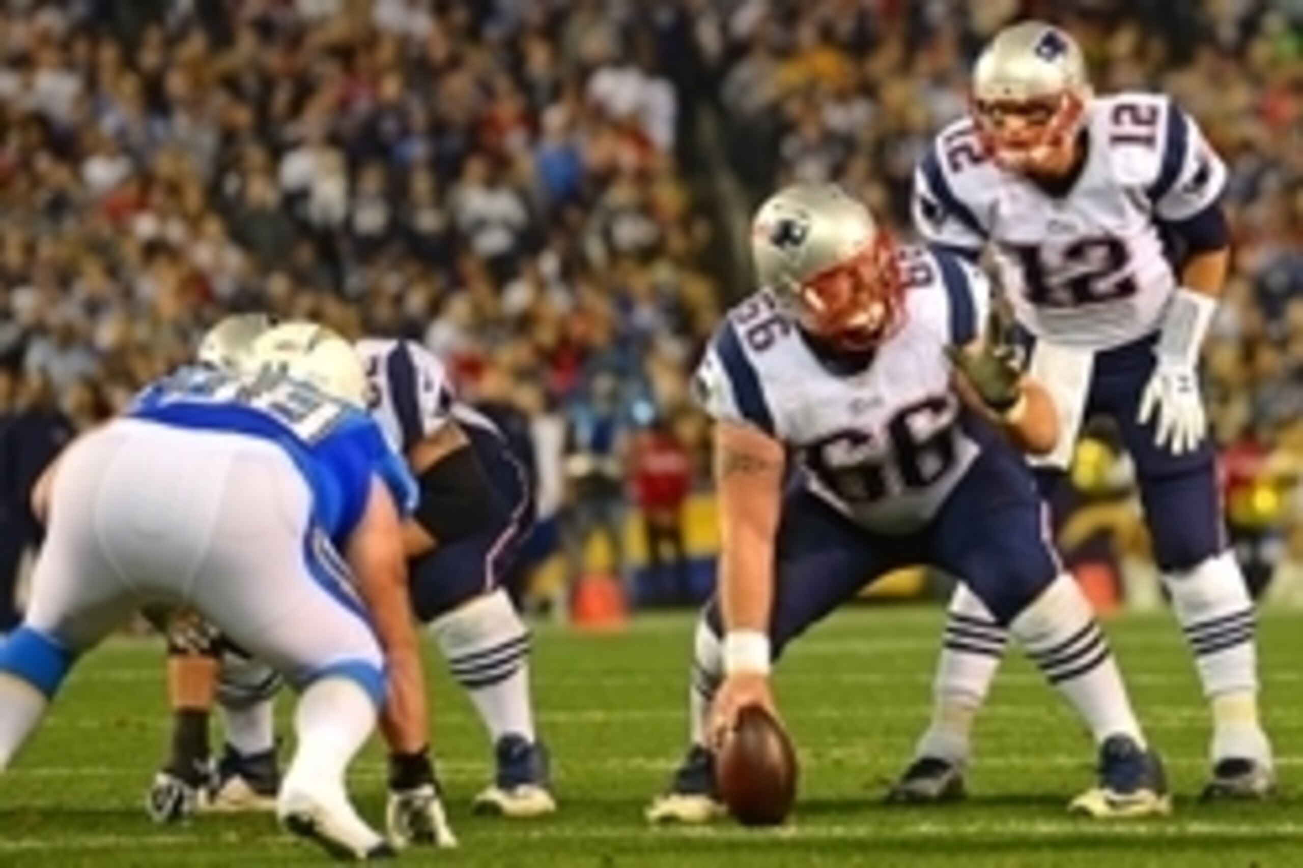 Dec 7, 2014; San Diego, CA, USA; New England Patriots quarterback Tom Brady (12) and center Bryan Stork (66) communicate at the line before the snap during the first quarter against the San Diego Chargers at Qualcomm Stadium. Mandatory Credit: Jake Roth-U