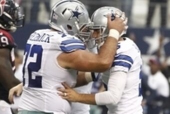 Oct 5, 2014; Arlington, TX, USA;  Dallas Cowboys center Travis Frederick (72) congratulates kicker Dan Bailey (5) after he kicked the game winning field goal in overtime against the Houston Texans at AT&T Stadium. Dallas beat Houston 20-17.  Mandatory Cre