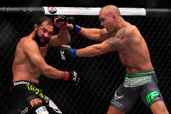 LAS VEGAS, NV - DECEMBER 06:  Robbie Lawler punches Johny Hendricks in their welterweight title fight during the UFC 181 event at the Mandalay Bay Events Center on December 6, 2014 in Las Vegas, Nevada.  (Photo by Alex Trautwig/Getty Images)