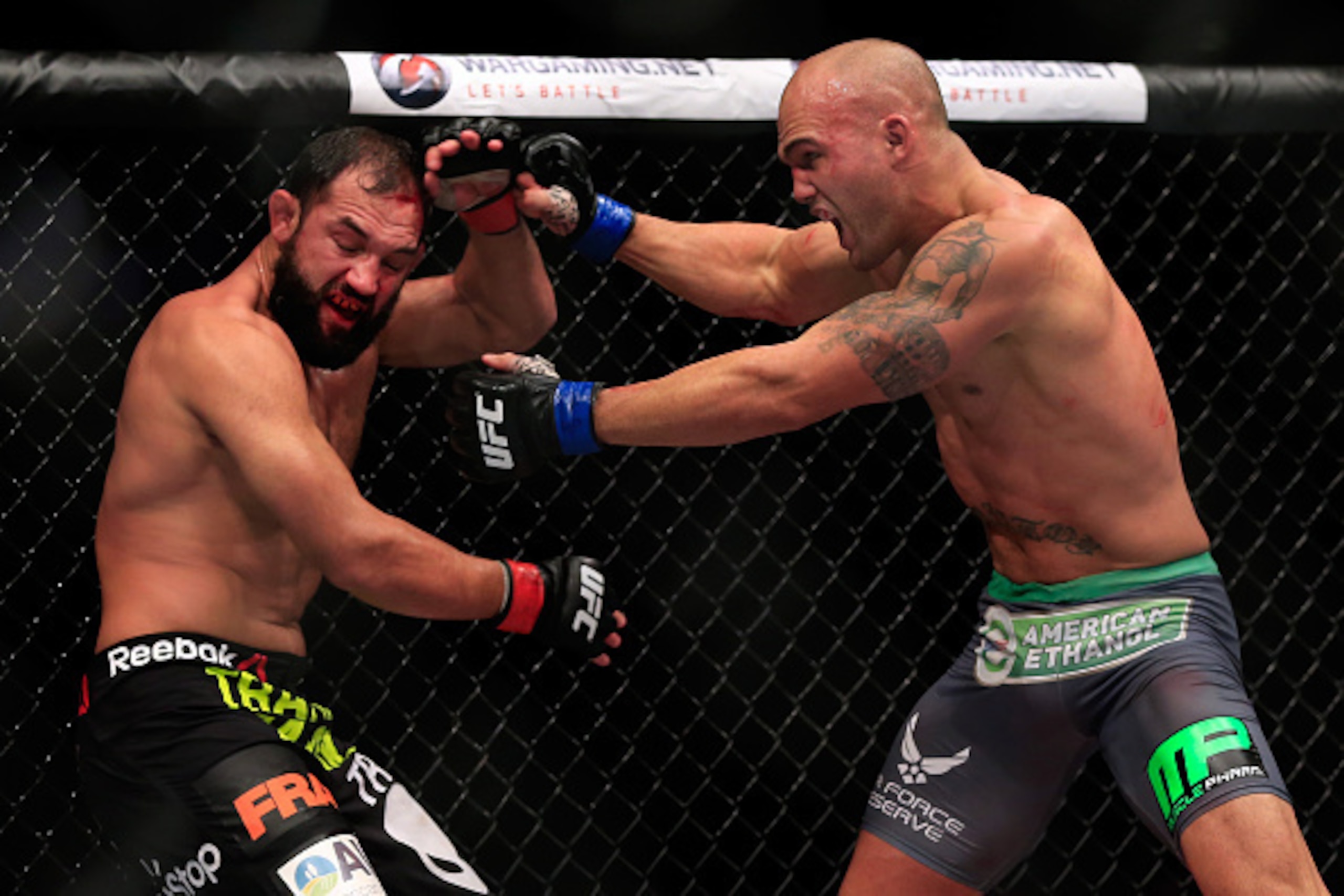 LAS VEGAS, NV - DECEMBER 06:  Robbie Lawler punches Johny Hendricks in their welterweight title fight during the UFC 181 event at the Mandalay Bay Events Center on December 6, 2014 in Las Vegas, Nevada.  (Photo by Alex Trautwig/Getty Images)