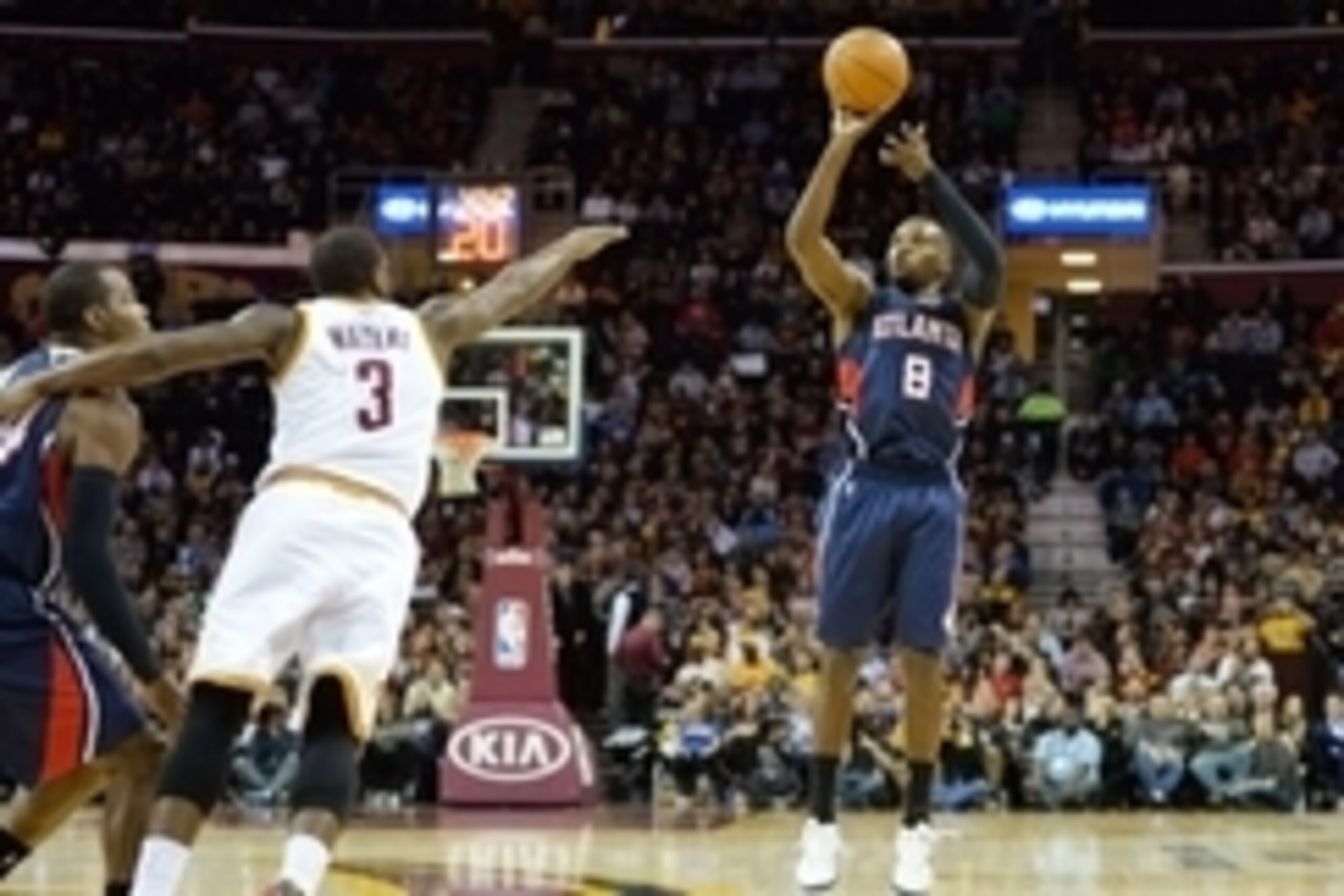 Dec 17, 2014; Cleveland, OH, USA; Atlanta Hawks guard Shelvin Mack (8) shoots against Cleveland Cavaliers guard Dion Waiters (3) in the second quarter at Quicken Loans Arena. Mandatory Credit: David Richard-USA TODAY Sports