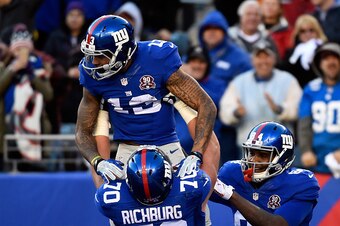 EAST RUTHERFORD, NJ - DECEMBER 14:  Odell Beckham Jr. #13 of the New York Giants celebrates with Weston Richburg #70 after scoring a 35 yard touchdown in the third quarter against the Washington Redskins during their game at MetLife Stadium on December 14