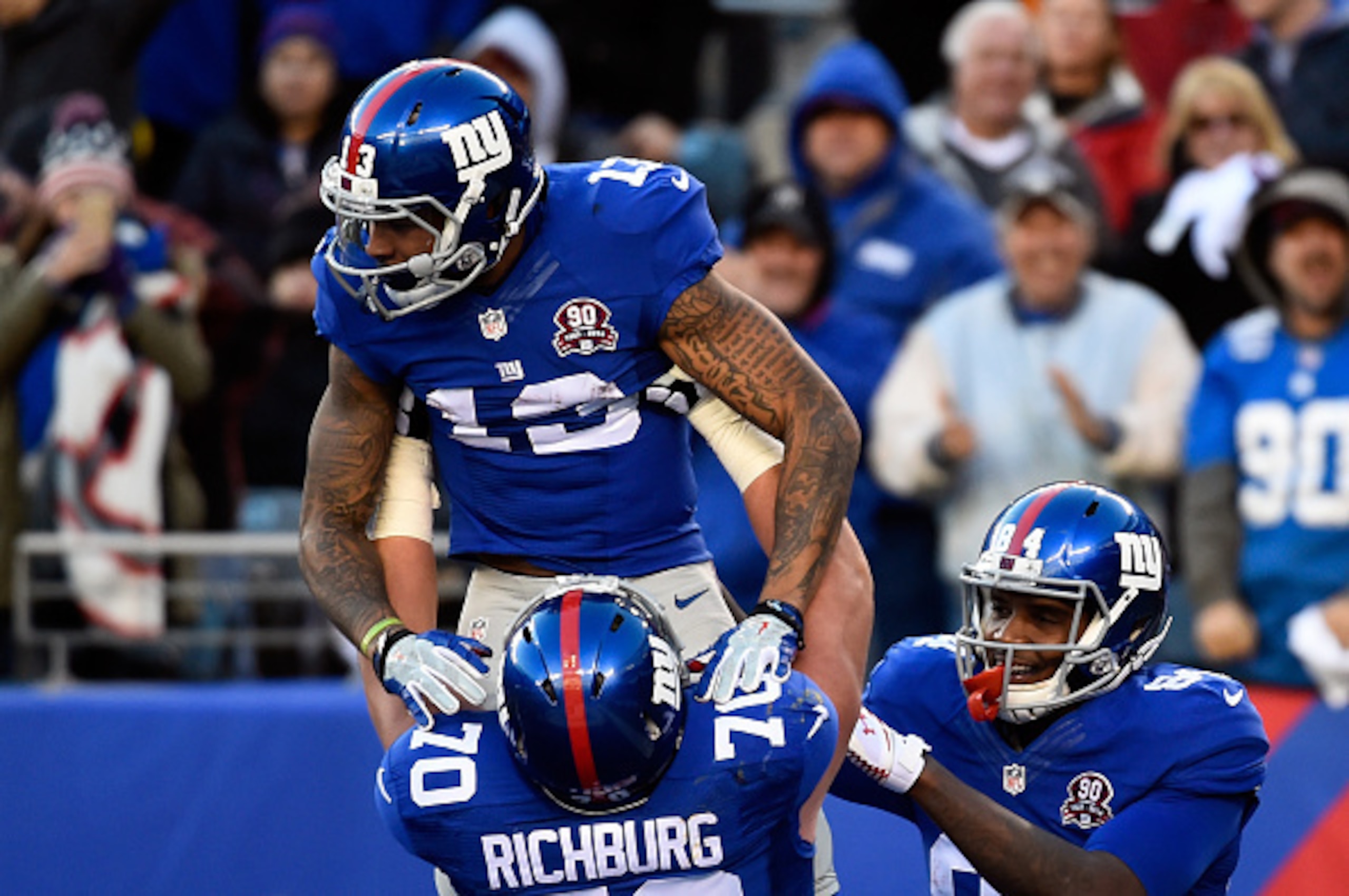 EAST RUTHERFORD, NJ - DECEMBER 14:  Odell Beckham Jr. #13 of the New York Giants celebrates with Weston Richburg #70 after scoring a 35 yard touchdown in the third quarter against the Washington Redskins during their game at MetLife Stadium on December 14