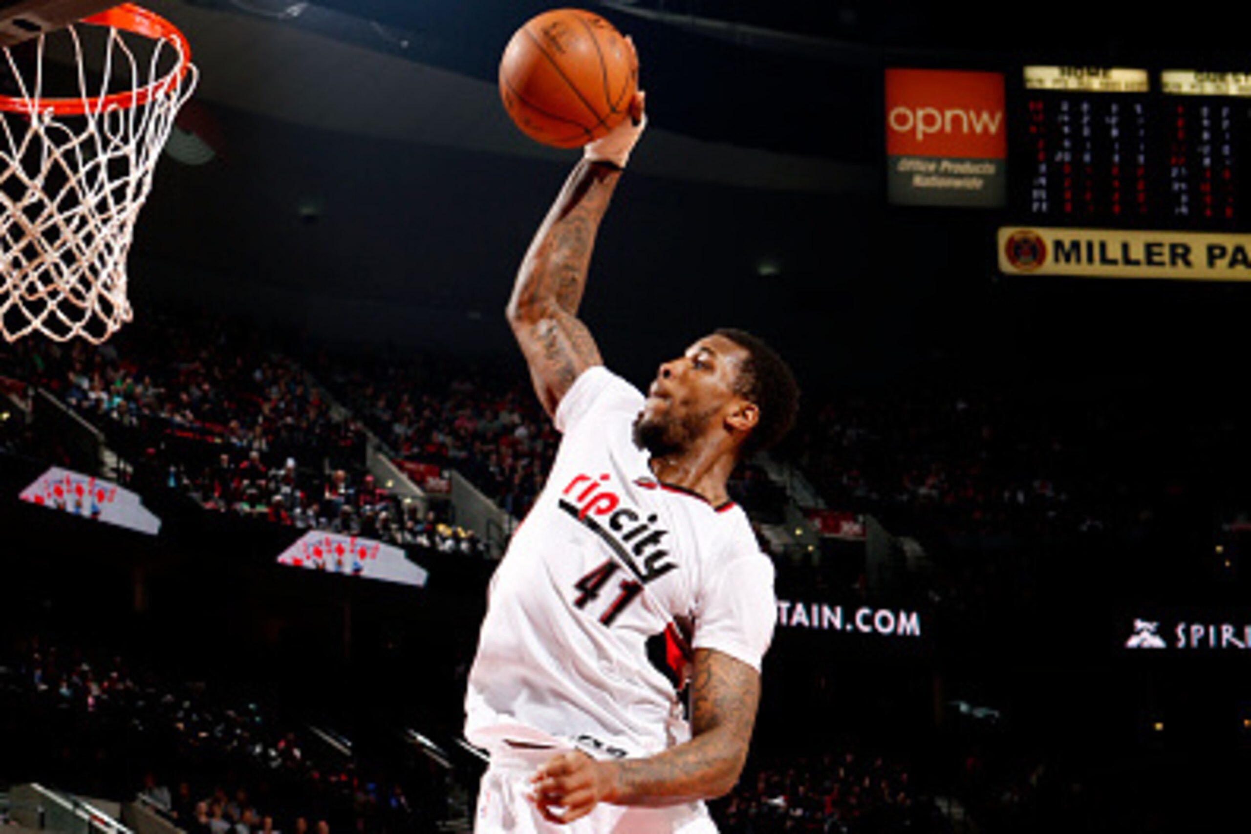 PORTLAND, OR - DECEMBER 17: Thomas Robinson #41 of the Portland Trail Blazers dunks against the Milwaukee Bucks on December 17, 2014 at the Moda Center Arena in Portland, Oregon. NOTE TO USER: User expressly acknowledges and agrees that, by downloading an