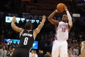 Nov 21, 2014; Oklahoma City, OK, USA; Oklahoma City Thunder guard Reggie Jackson (15) shoots against Brooklyn Nets guard Alan Anderson (6) during the fourth quarter at Chesapeake Energy Arena. Mandatory Credit: Mark D. Smith-USA TODAY Sports