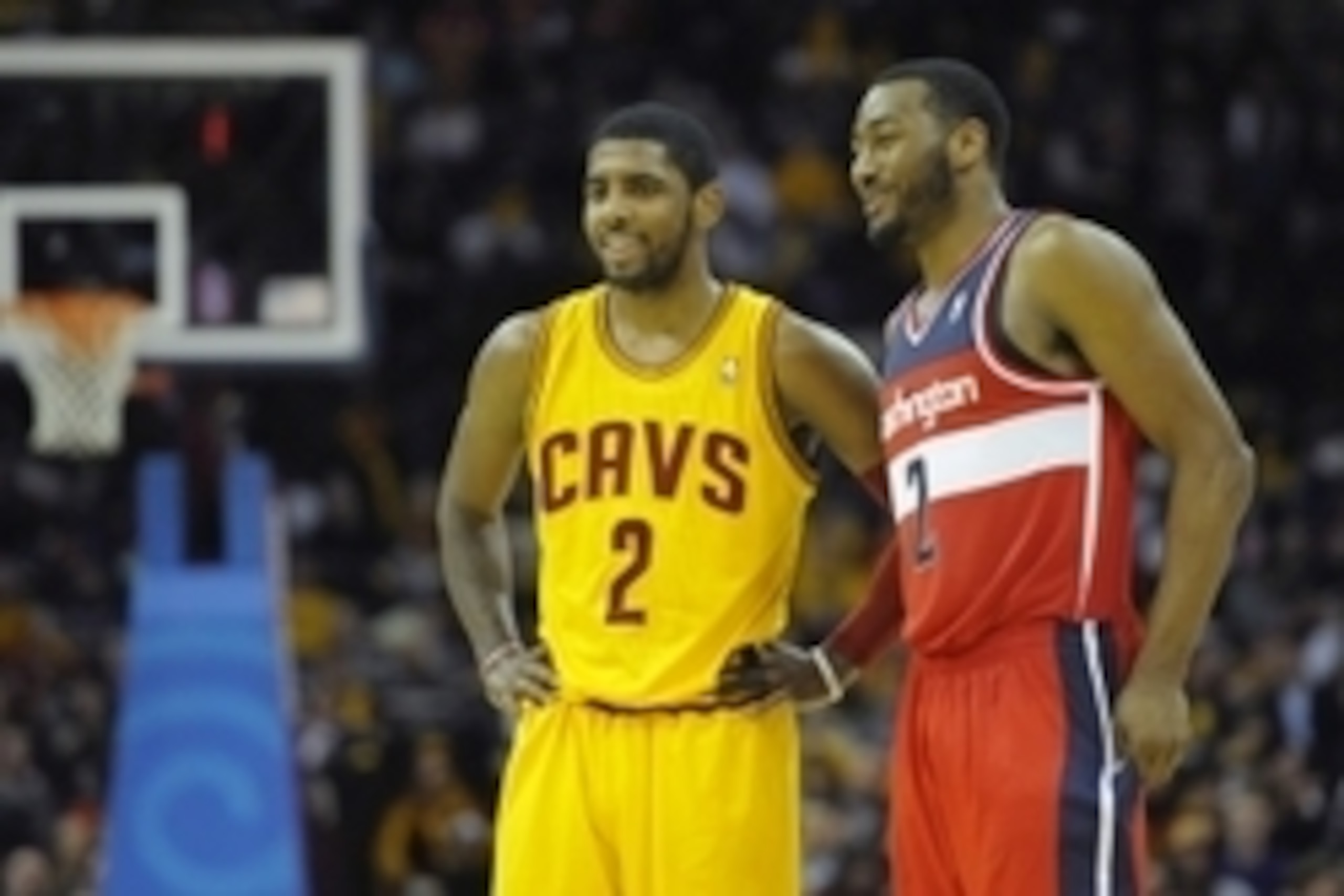 Feb 23, 2014; Cleveland, OH, USA; Cleveland Cavaliers point guard Kyrie Irving (2) and Washington Wizards point guard John Wall (2) talk in the fourth quarter at Quicken Loans Arena. Mandatory Credit: David Richard-USA TODAY Sports