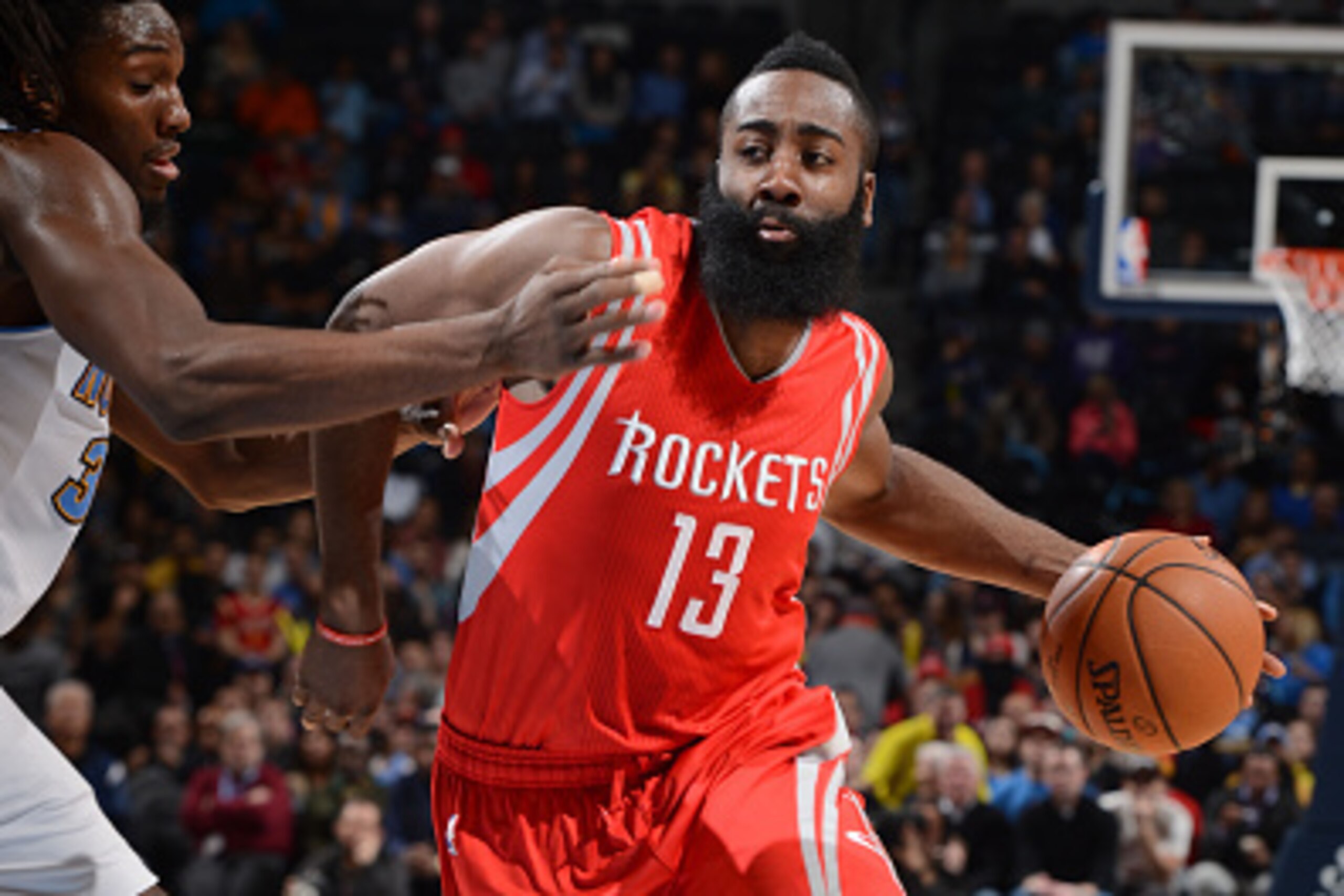 DENVER, CO - December 17:  James Harden #13 of the Houston Rockets handles the ball against the Denver Nuggets on December 17, 2014 at Pepsi Center in Denver, Colorado. NOTE TO USER: User expressly acknowledges and agrees that, by downloading and or using