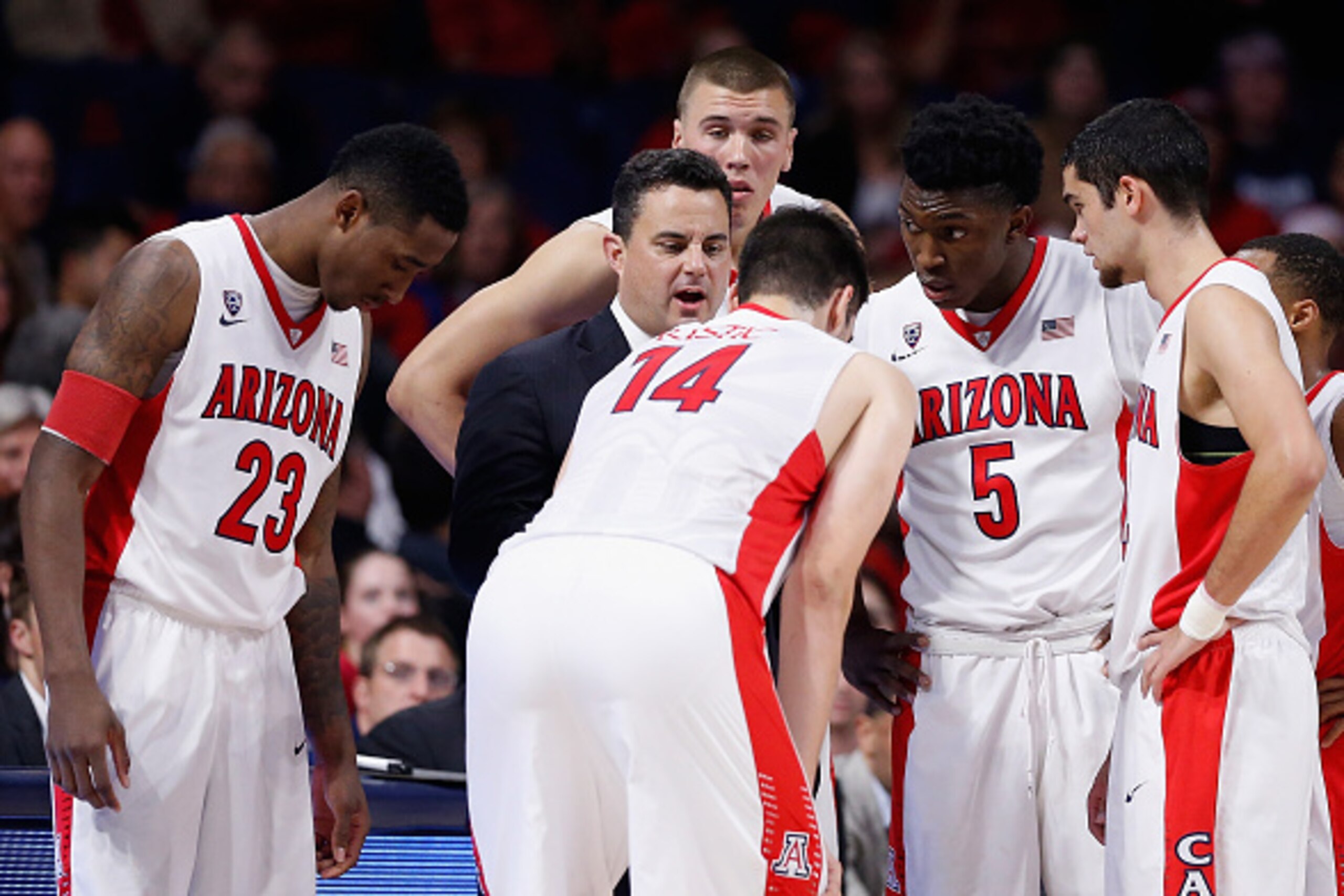 TUCSON, AZ - DECEMBER 09:  Head coach Sean Miller of the Arizona Wildcats talks with Rondae Hollis-Jefferson #23, Dusan Ristic #14, Stanley Johnson #5 and Elliott Pitts #24 in the huddle during the second half of the college basketball game against the Ut