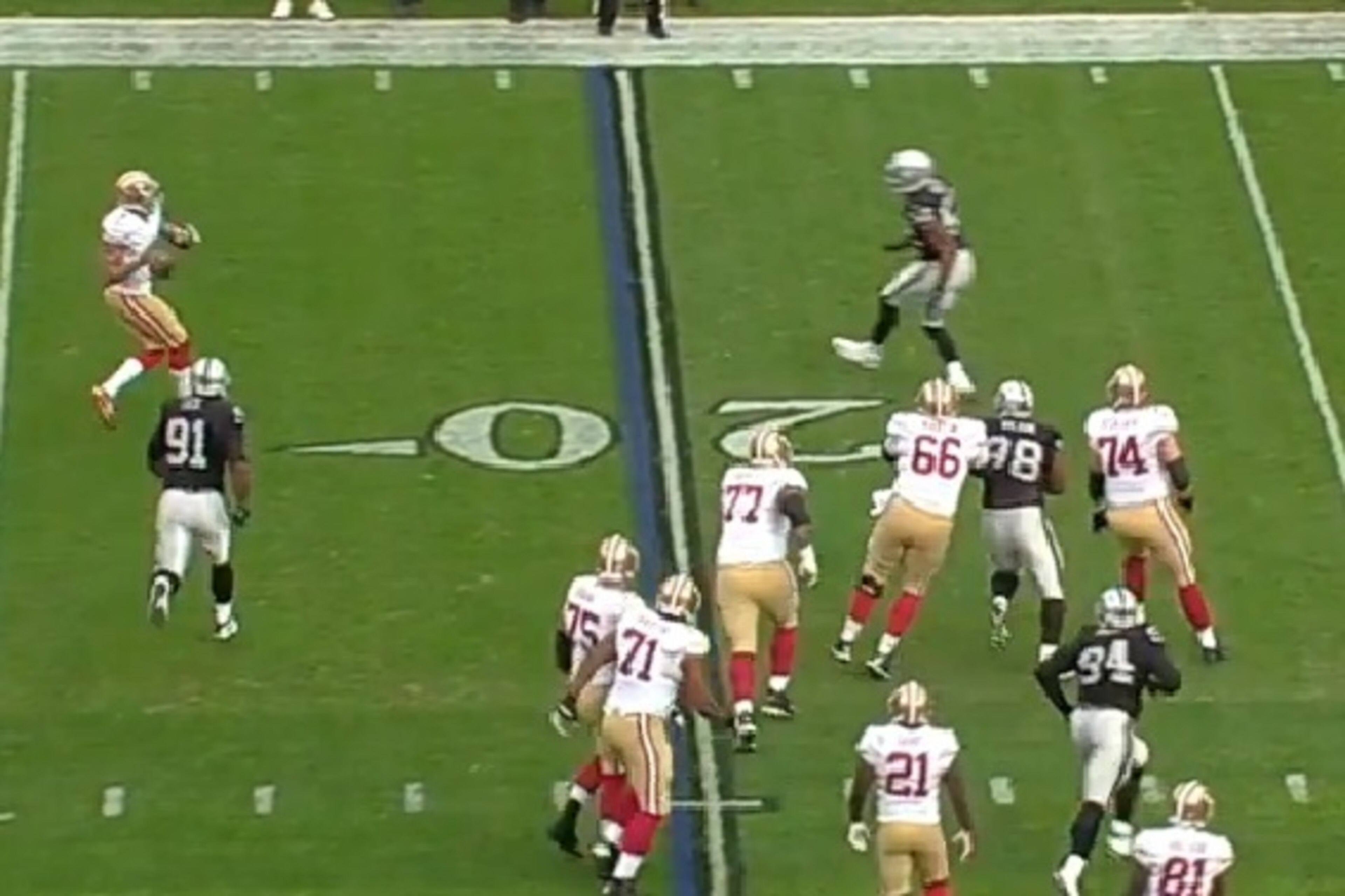 Linebacker Khalil Mack stays on Kaepernick, preventing him from scrambling. Kaepernick then heaves a prayer downfield.