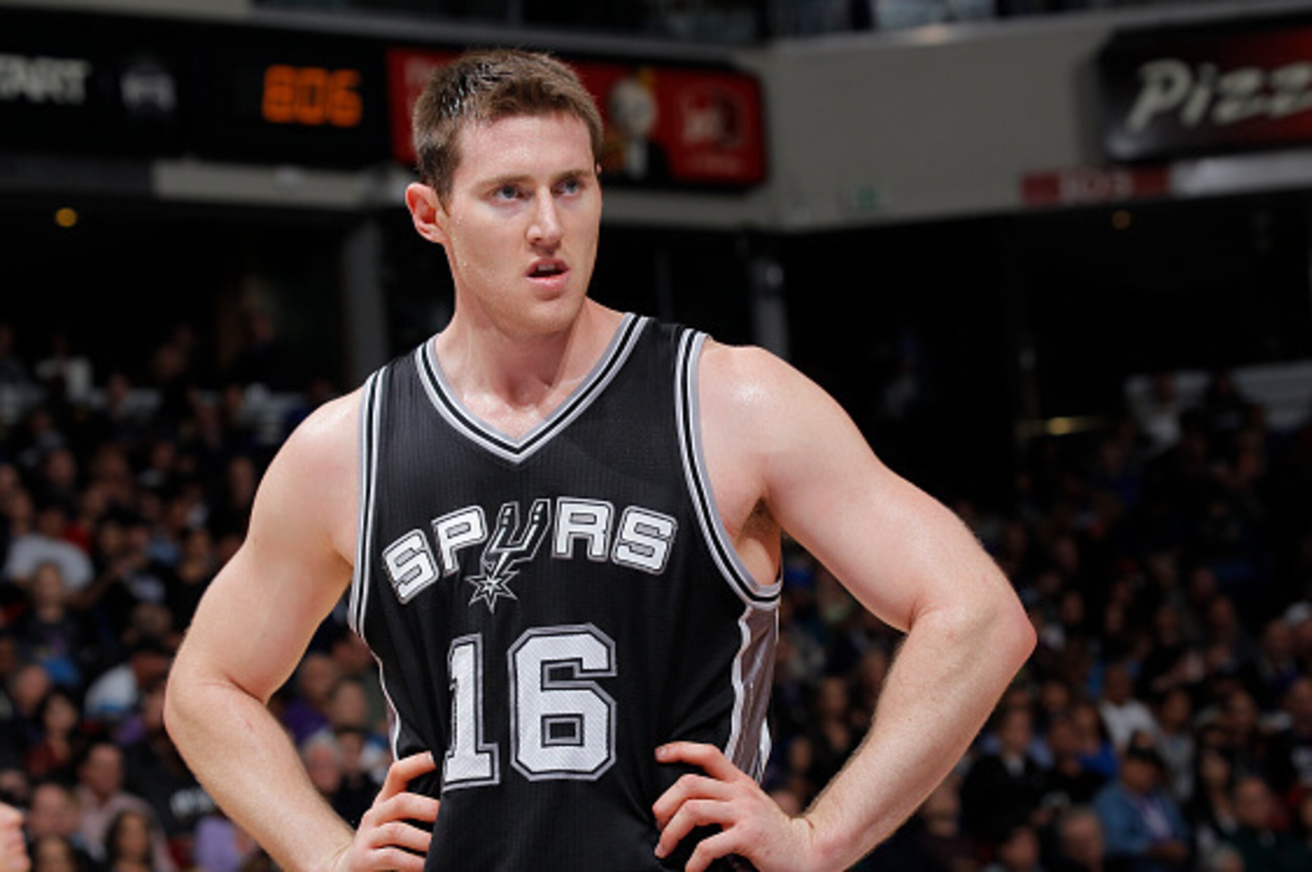 SACRAMENTO, CA - NOVEMBER 15: Aron Baynes #16 of the San Antonio Spurs stands on the court during the game against the Sacramento Kings on November 15, 2014 at Sleep Train Arena in Sacramento, California. NOTE TO USER: User expressly acknowledges and agre