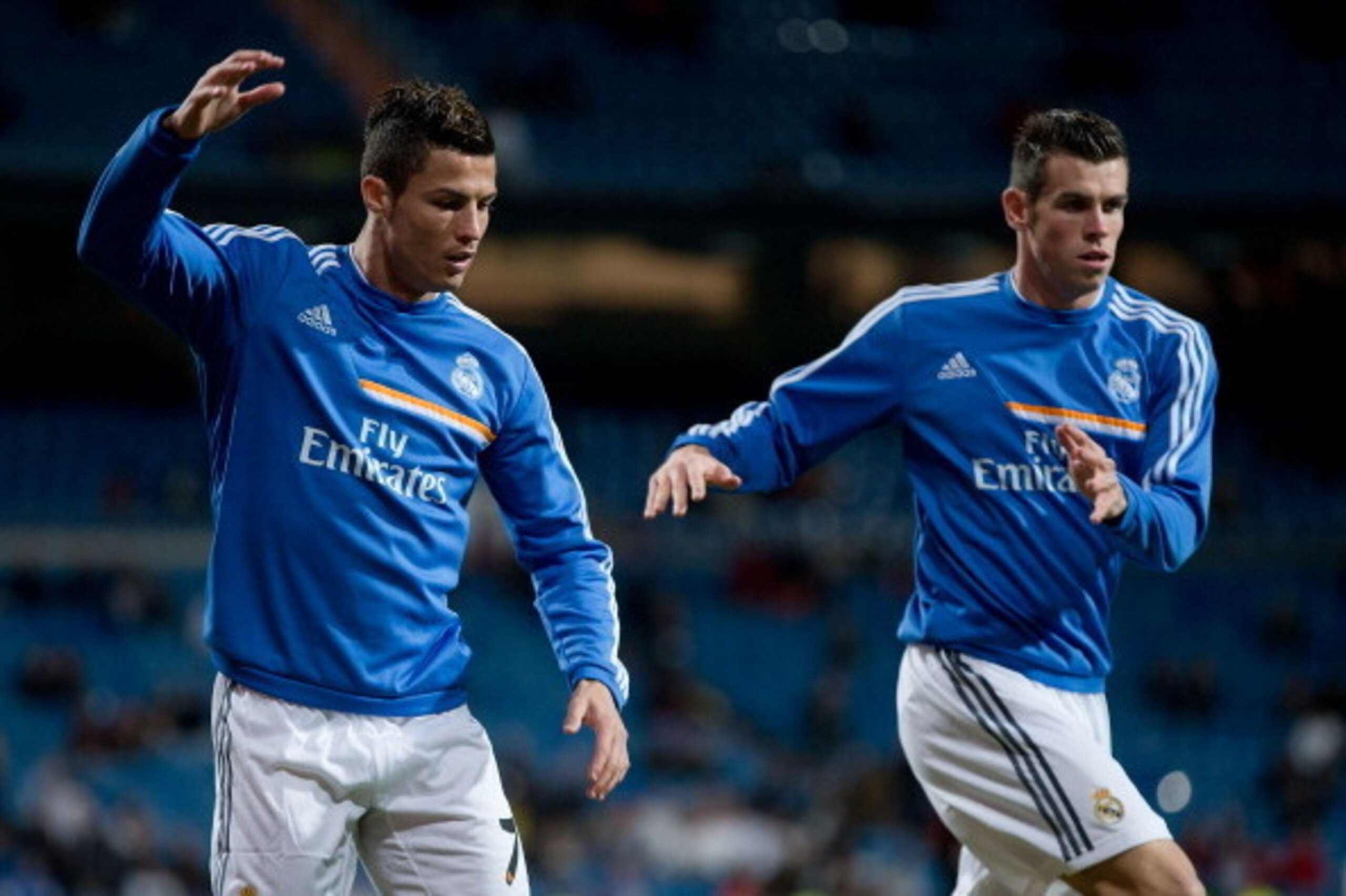 MADRID, SPAIN - OCTOBER 30: Cristiano Ronaldo (L) of Real Madrid CF and his teammate Gareth Bale (R) warm up prior to start the La Liga match between Real Madrid CF and Sevilla FC at Estadio Santiago Bernabeu on October 30, 2013 in Madrid, Spain. (Photo MADRID, SPAIN - OCTOBER 30: Cristiano Ronaldo (L) of Real Madrid CF and his teammate Gareth Bale (R) warm up prior to start the La Liga match between Real Madrid CF and Sevilla FC at Estadio Santiago Bernabeu on October 30, 2013 in Madrid, Spain. (Photo