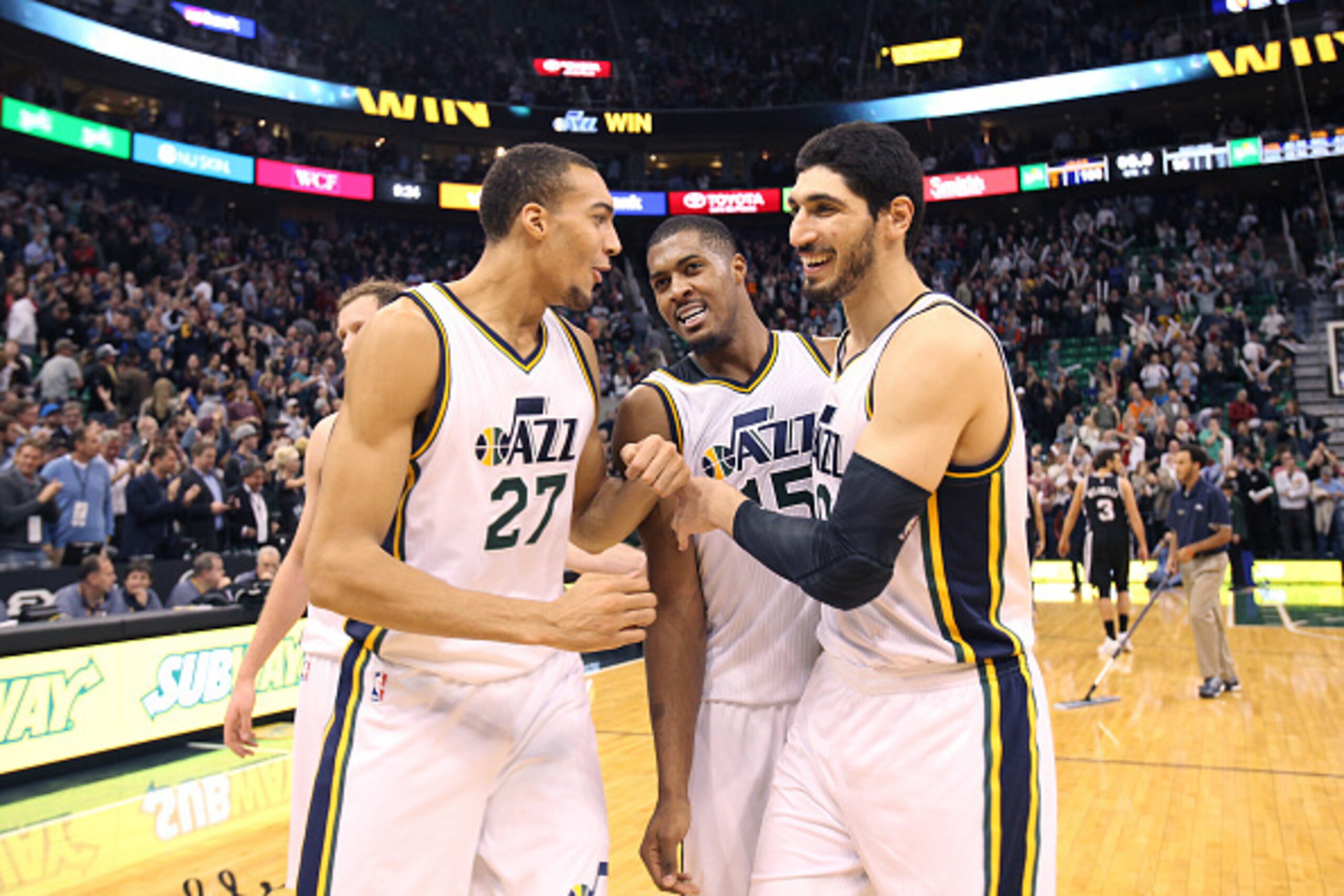 SALT LAKE CITY, UT -  DECEMBER 9: Rudy Gobert #27, Derrick Favors #15 and Enes Kanter #0 of the Utah Jazz after the  game against the San Antonio Spurs on December 9, 2014 at EnergySolutions Arena in Salt Lake City, Utah. NOTE TO USER: User expressly ackn
