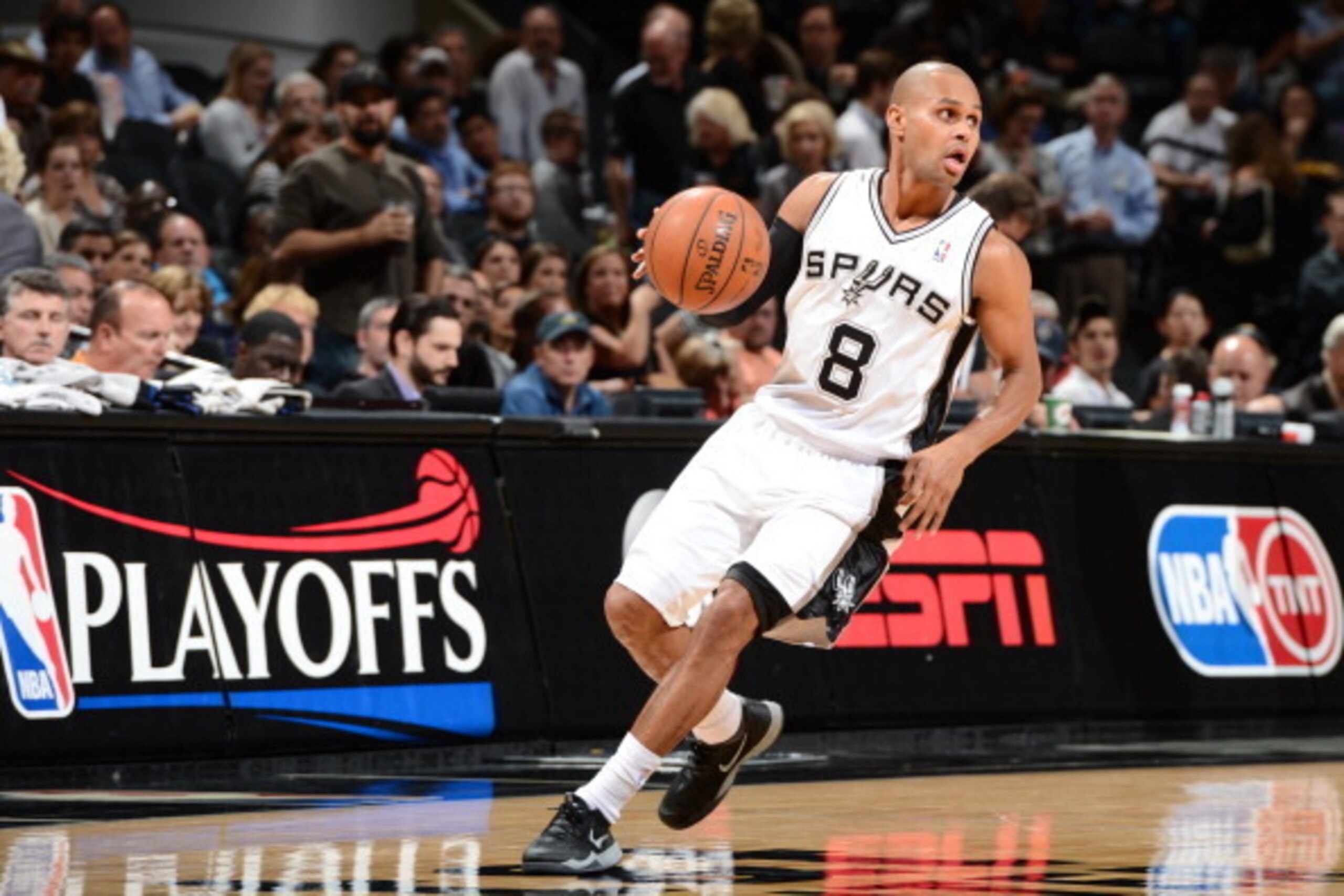 SAN ANTONIO, TX - MAY 14: Patty Mills #8 of the San Antonio Spurs handles the ball against the Portland Trail Blazers in Game Five of the Western Conference Semifinals during the 2014 NBA Playoffs on May 14, 2014 at the AT&T Center in San Antonio, Texas. 