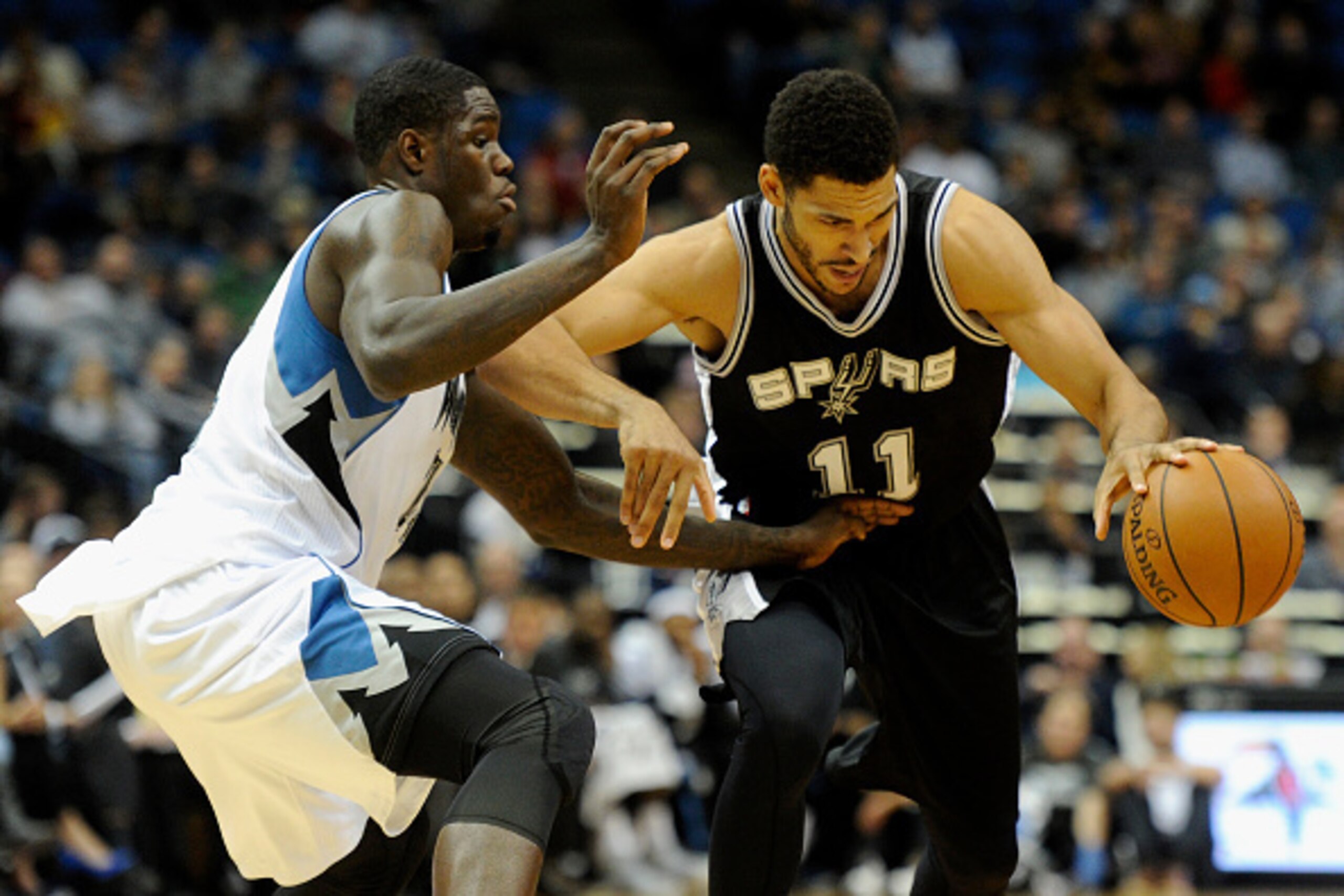 MINNEAPOLIS, MN - NOVEMBER 21: Anthony Bennett #24 of the Minnesota Timberwolves defends against Jeff Ayres #11 of the San Antonio Spurs during the fourth quarter of the game on November 21, 2014 at Target Center in Minneapolis, Minnesota. The Spurs defea