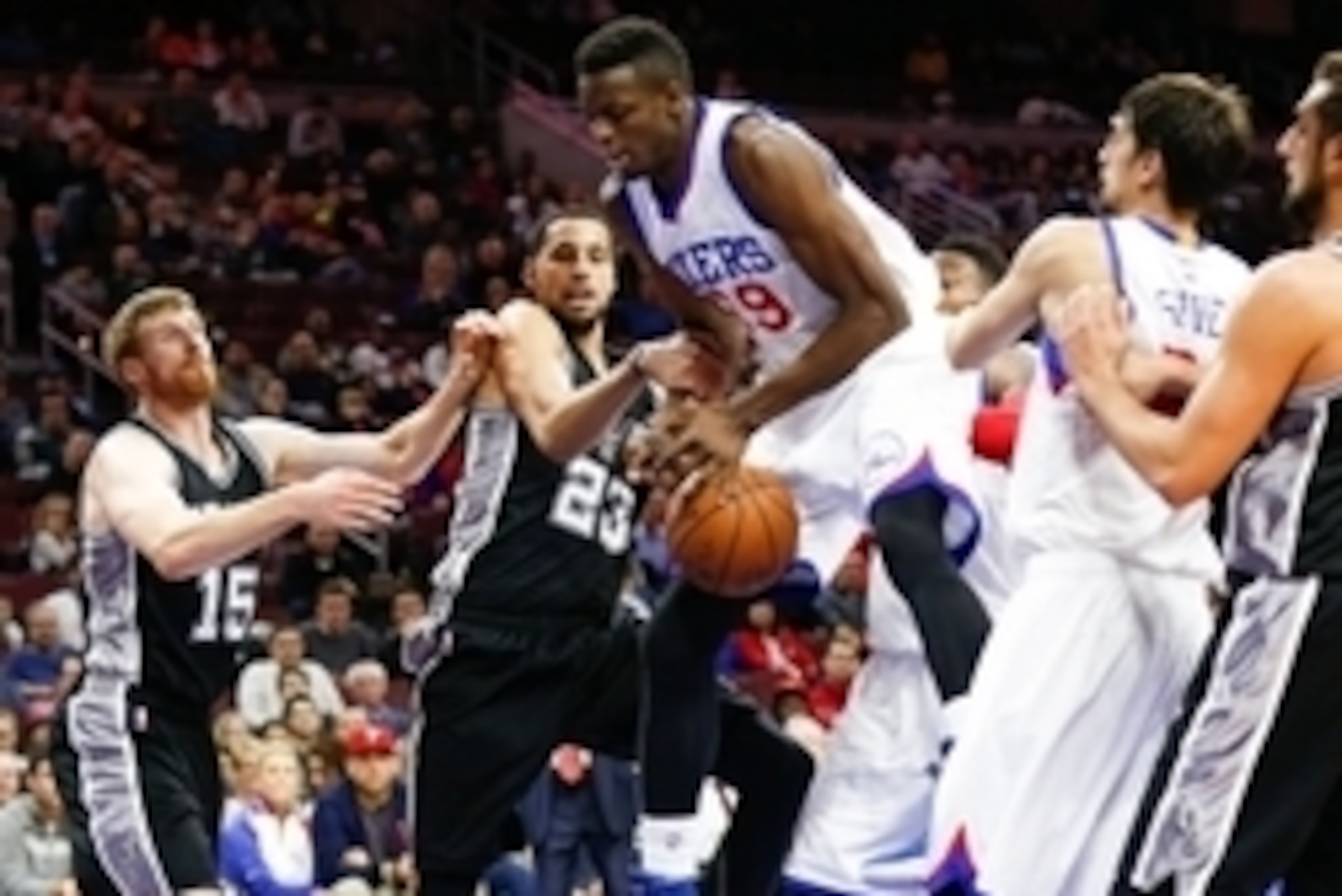 Dec 1, 2014; Philadelphia, PA, USA; Philadelphia 76ers forward Jerami Grant (39) looses the ball as he goes for a shot past San Antonio Spurs forward Austin Daye (23) and forward Matt Bonner (15) during the second half at Wells Fargo Center. The Spurs def