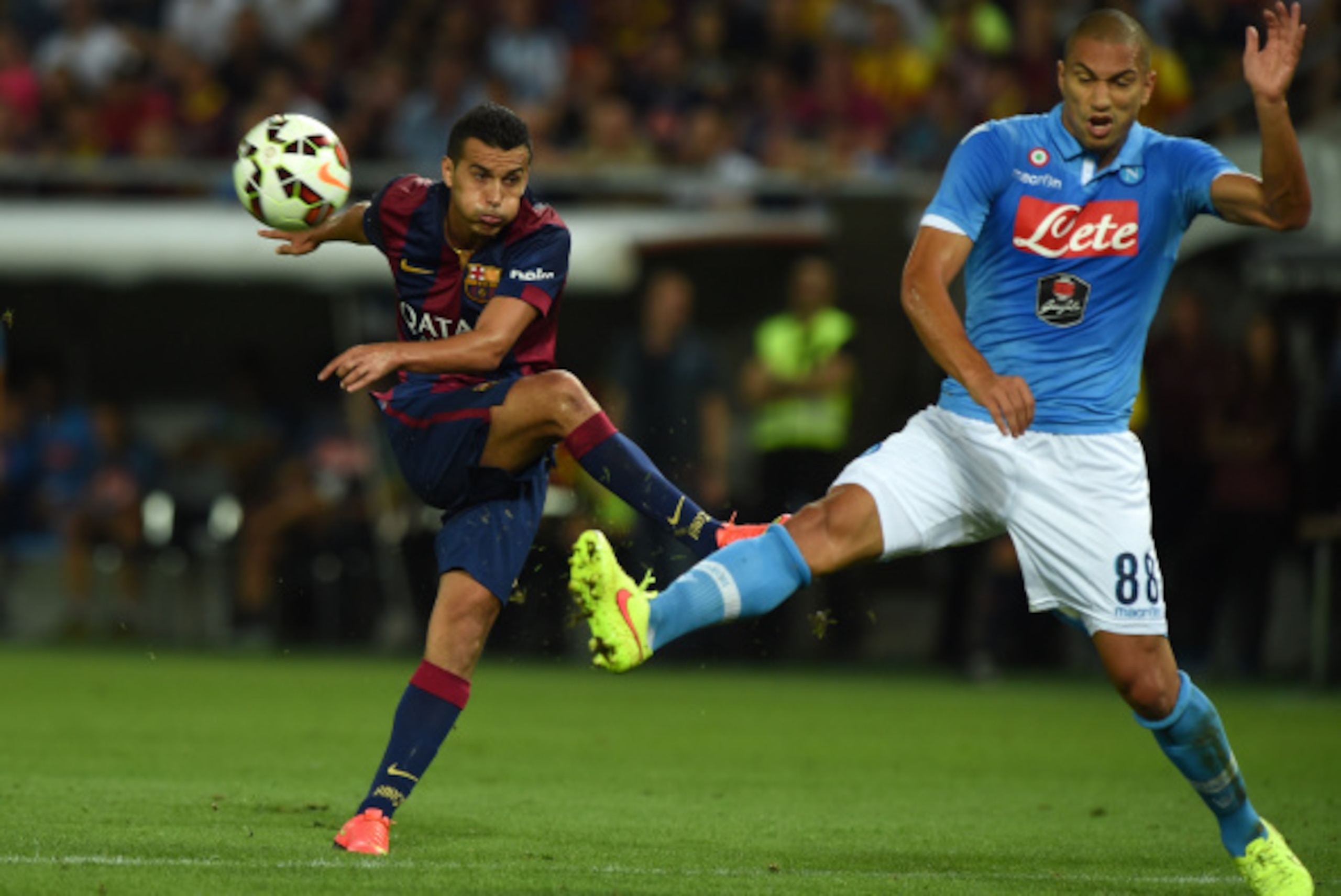 GENEVA, SWITZERLAND - AUGUST 06:  Pedro Rodriguez (L) of FC Barcelona in action against Gokhan Inler of SSC Napoli during the pre-season friendly match between FC Barcelona and SSC Napoli on August 6, 2014 in Geneva, Switzerland.  (Photo by Valerio Pennic