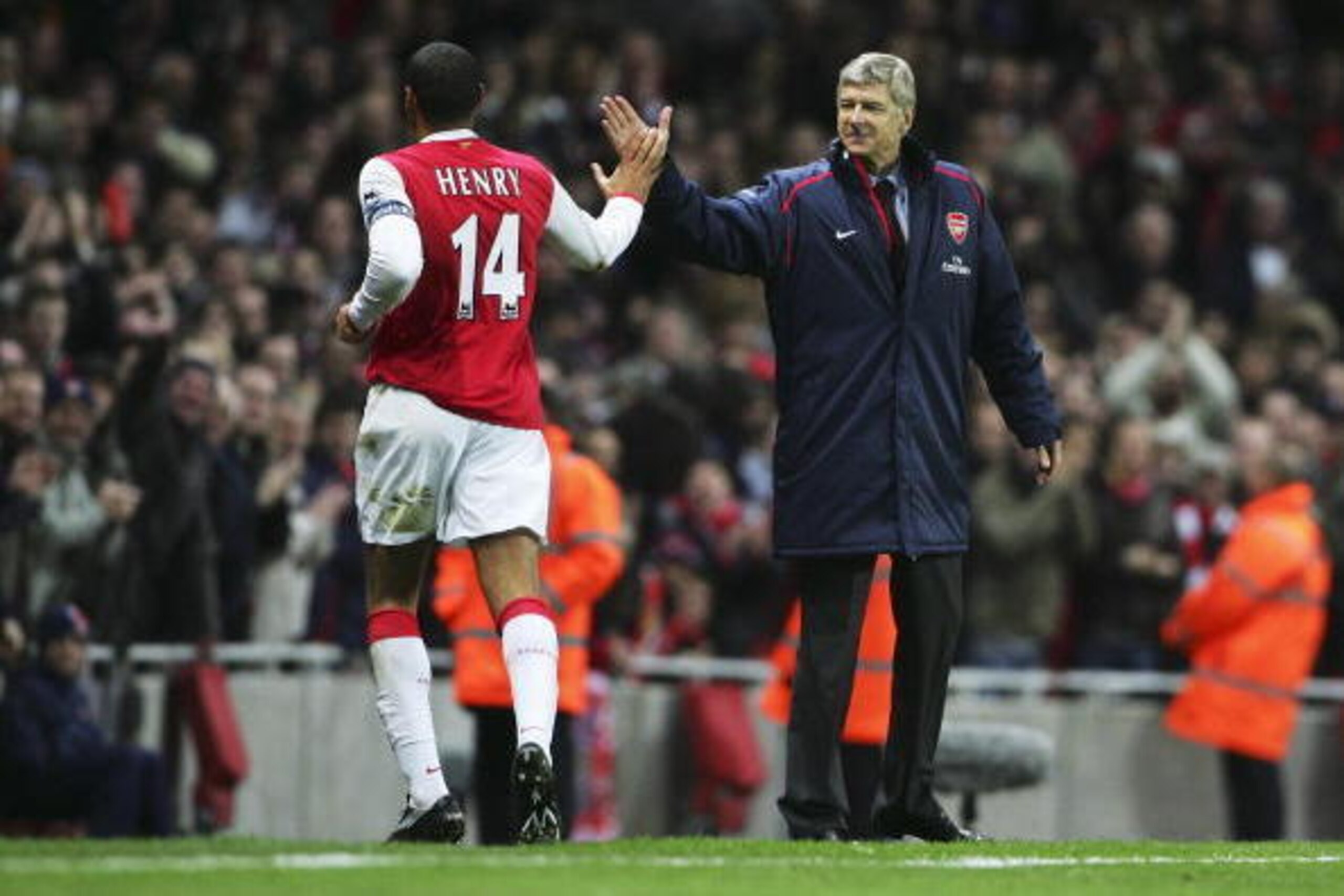 LONDON - JANUARY 02:  Thierry Henry of Arsenal celebrates with manager Arsene Wenger as he scores their first goal from the penalty spot during the Barclays Premiership match between Arsenal and Charlton Athletic at the Emirates Stadium on January 2, 2007