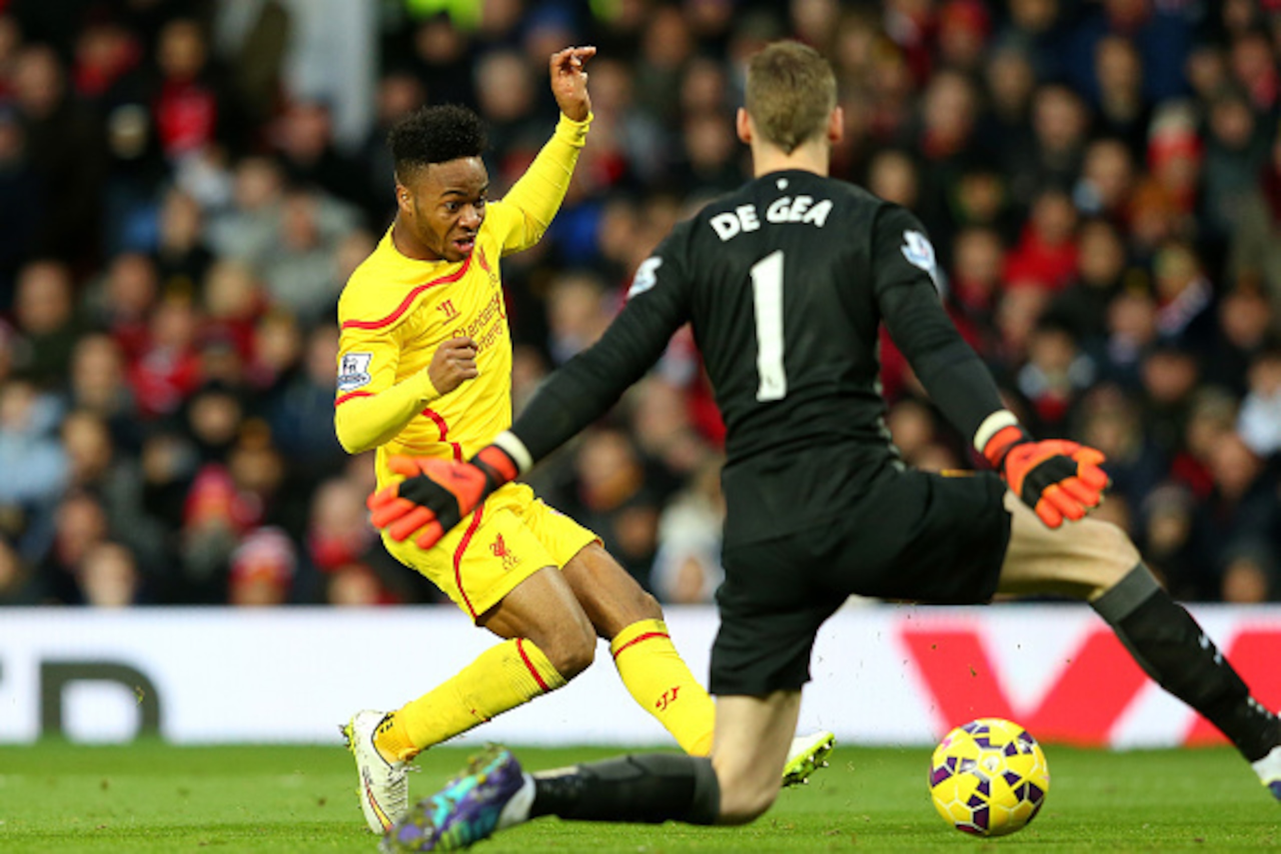 MANCHESTER, ENGLAND - DECEMBER 14:  Dvid De Gea of Manchester United saves the attempt on goal of Raheem Sterling of Liverpool in a one on one situation during the Barclays Premier League match between Manchester United and Liverpool at Old Trafford on De