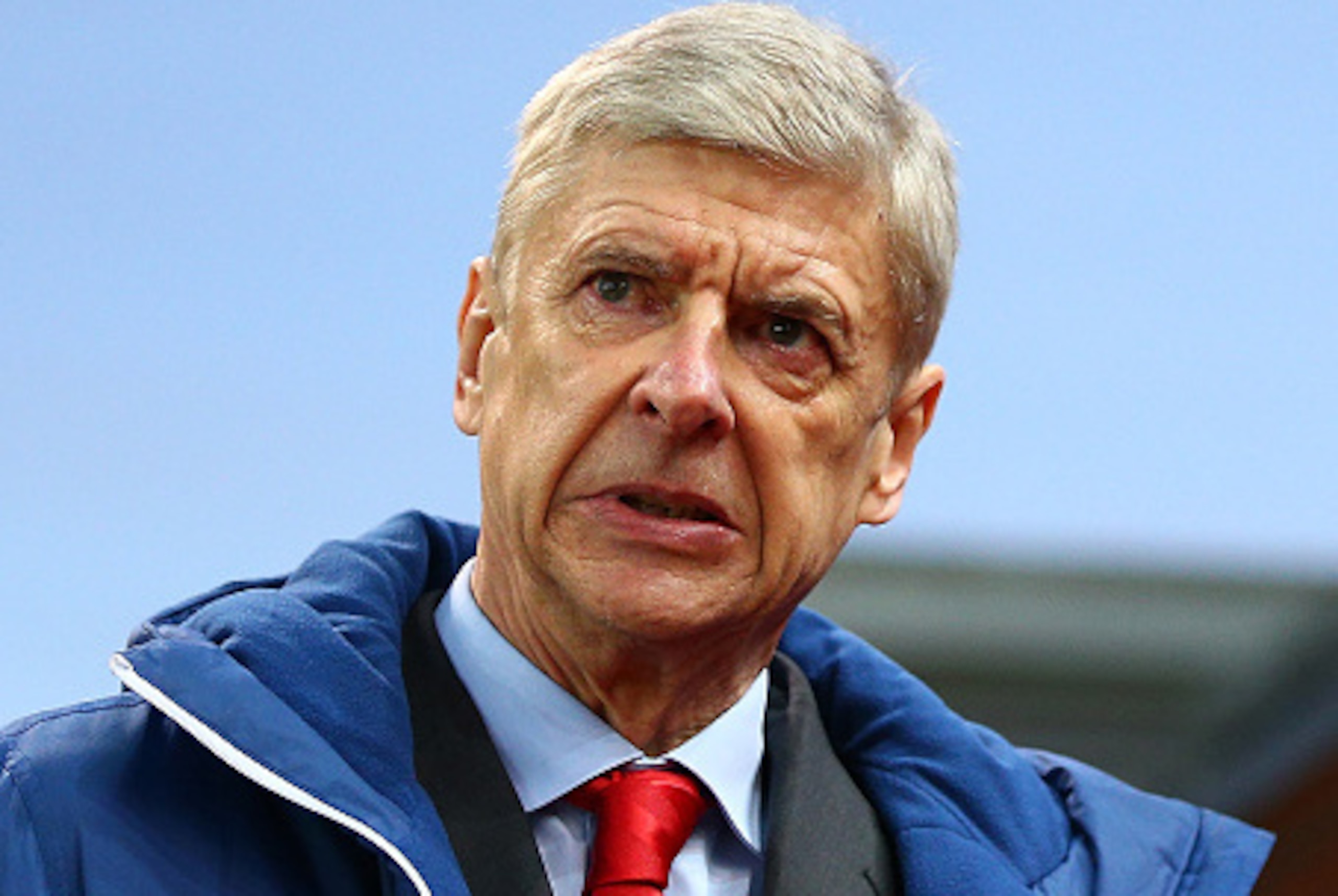 STOKE ON TRENT, ENGLAND - DECEMBER 06:  Arsenal Manager Arsene Wenger walks to his dugout during the Barclays Premier League match between Stoke City and Arsenal  at the Britannia Stadium on December 6, 2014 in Stoke on Trent, England.  (Photo by Clive Ma