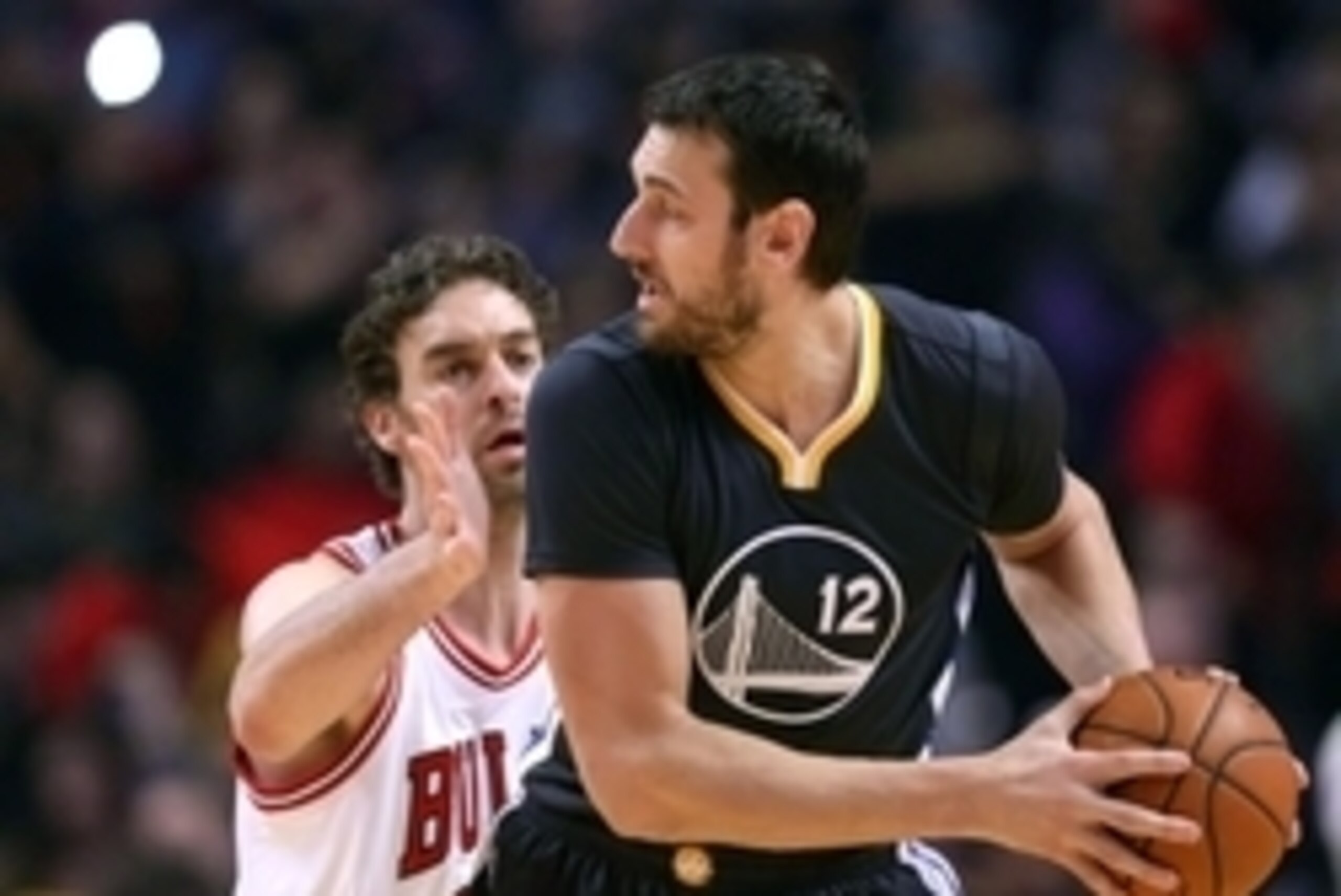 Dec 6, 2014; Chicago, IL, USA; Golden State Warriors center Andrew Bogut (12) is defended by Chicago Bulls forward Pau Gasol (16) during the first quarter at the United Center. Mandatory Credit: Dennis Wierzbicki-USA TODAY Sports