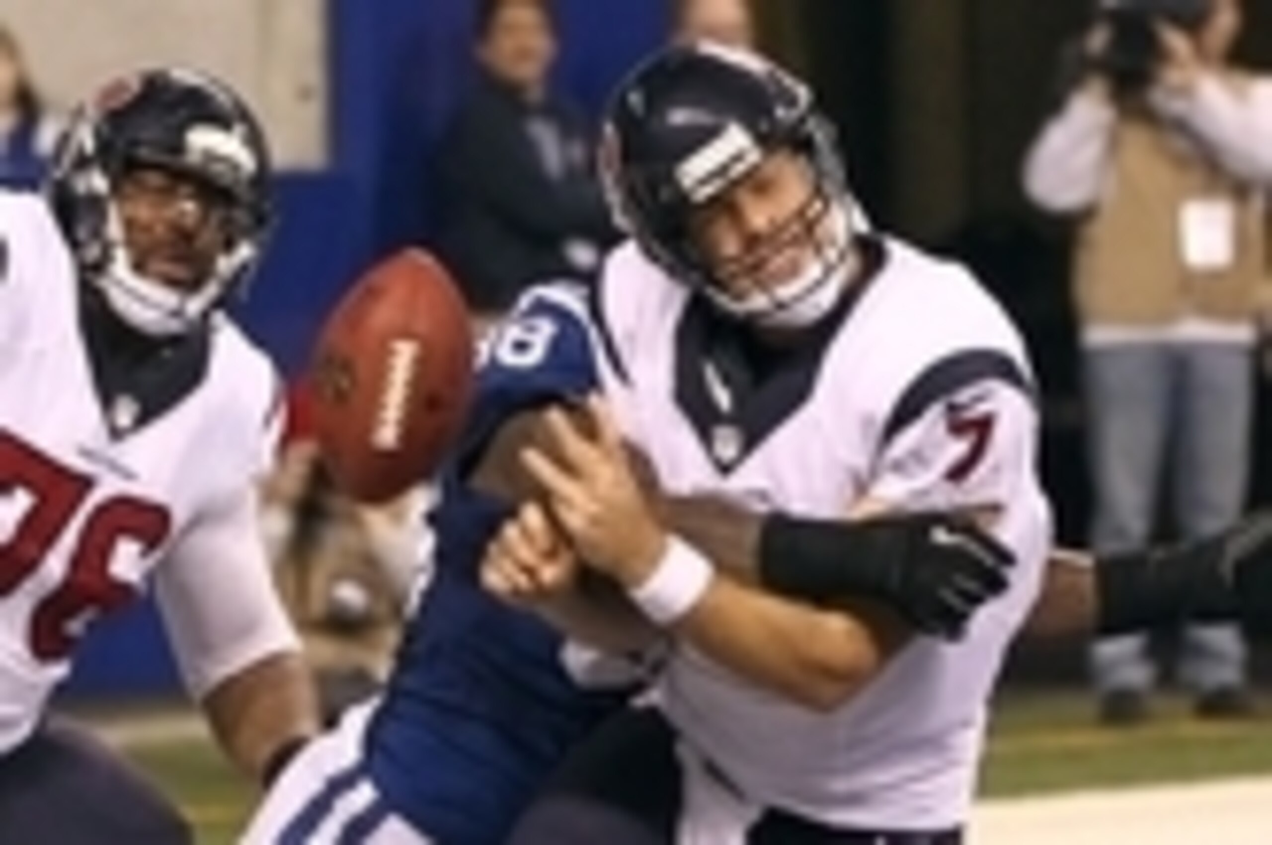 Dec 15, 2013; Indianapolis, IN, USA; Indianapolis Colts outside linebacker Robert Mathis (98) sacks Houston Texans quarterback Case Keenum (7) in the end zone during the third quarter at Lucas Oil Stadium. The Colts won 25-3. Mandatory Credit: Pat Lovell-