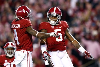 TUSCALOOSA, AL - NOVEMBER 15:  Cyrus Jones #5 of the Alabama Crimson Tide reacts after intercepting a touchdown reception intended for De'Runnya Wilson #1 of the Mississippi State Bulldogs with Eddie Jackson #4 at Bryant-Denny Stadium on November 15, 2014