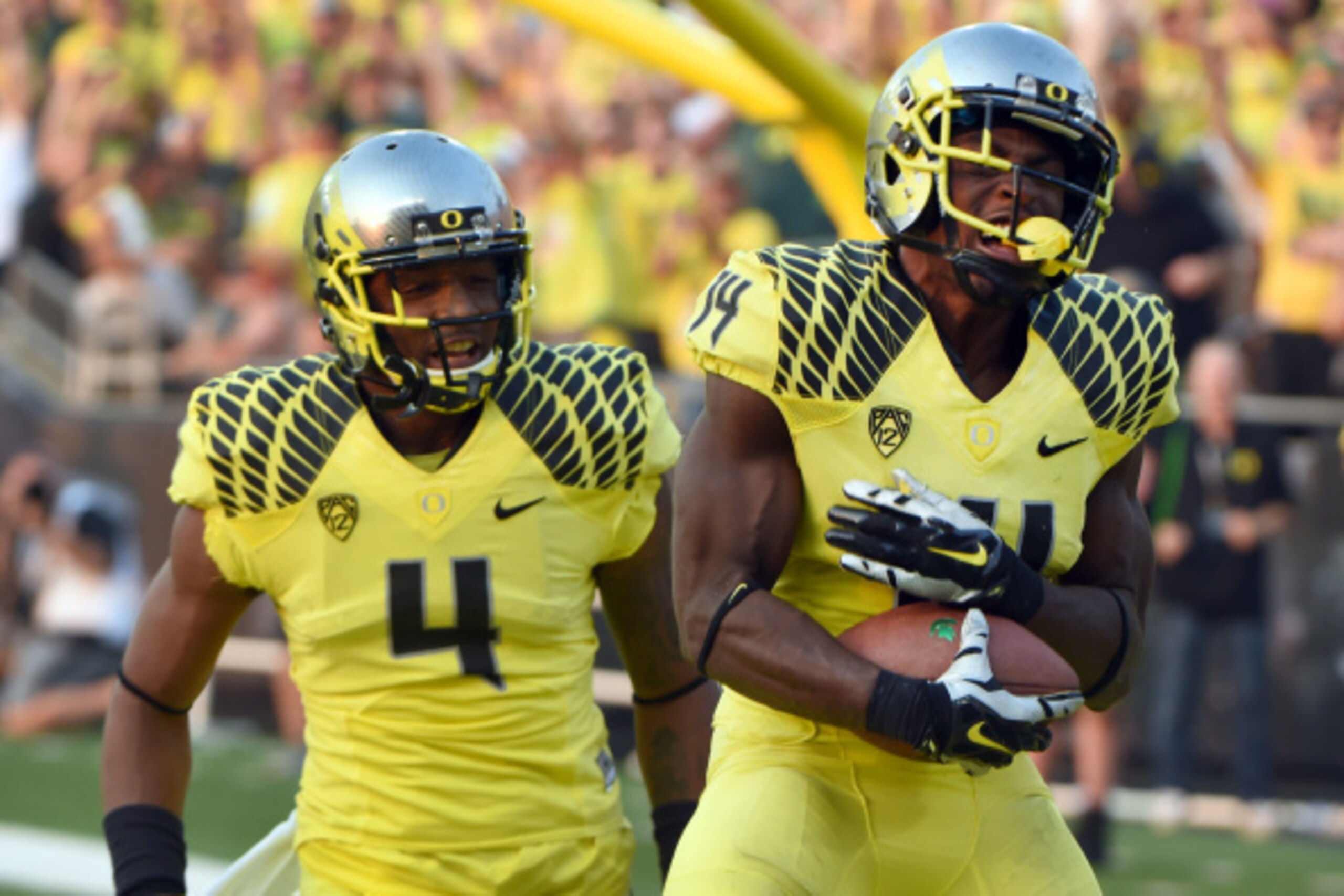 EUGENE, OR -SEPTEMBER 06: Defensive back Ifo Ekpre-Olomu #14 of the Oregon Ducks celebrates with defensive back Erick Dargan #4 of the Oregon Ducks after intercepting a pass during the fourth quarter of the game against the Michigan State Spartans at Autz
