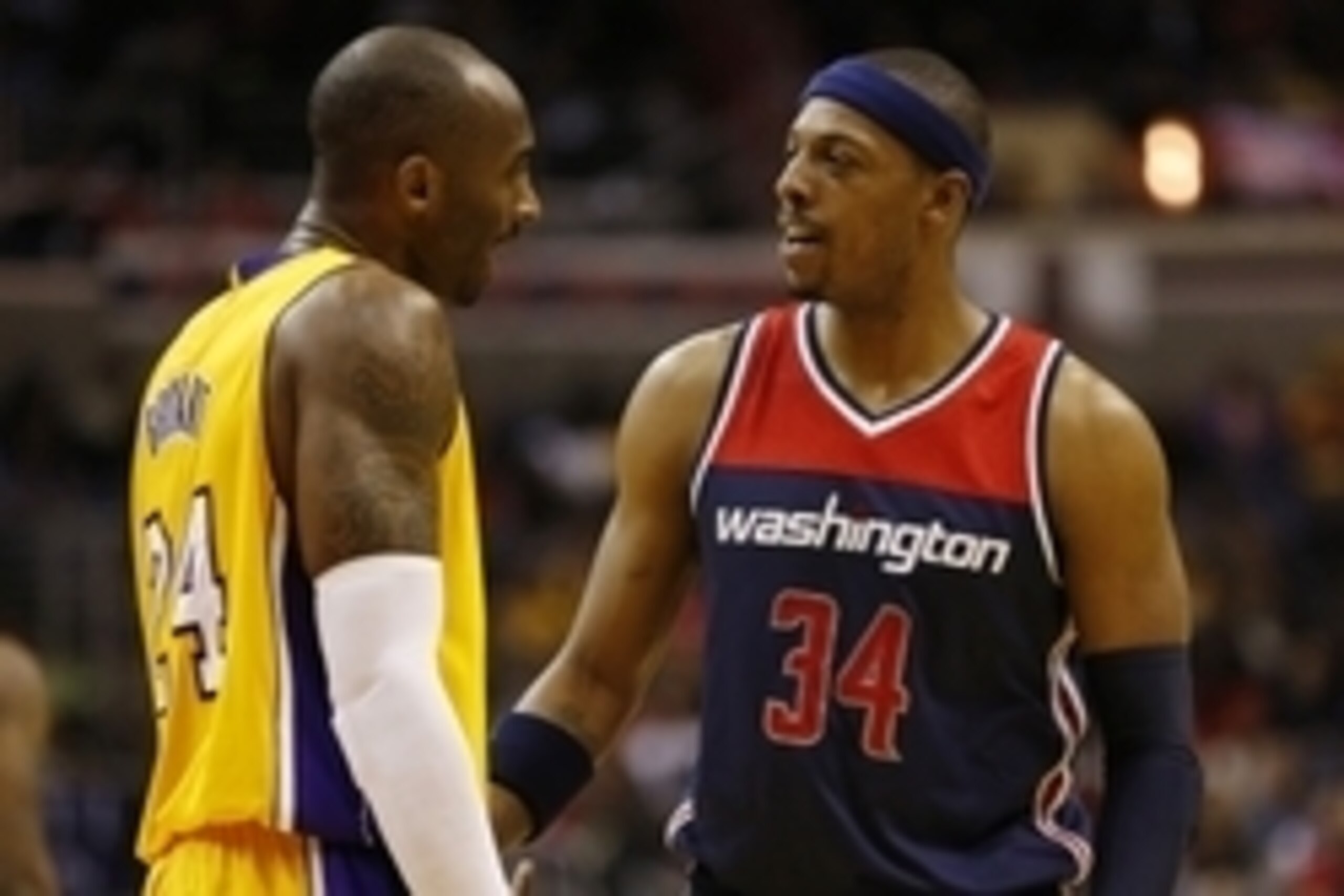 Dec 3, 2014; Washington, DC, USA; Washington Wizards forward Paul Pierce (34) talks to Los Angeles Lakers guard Kobe Bryant (24) in the third quarter at Verizon Center. The Wizards won 111-95. Mandatory Credit: Geoff Burke-USA TODAY Sports