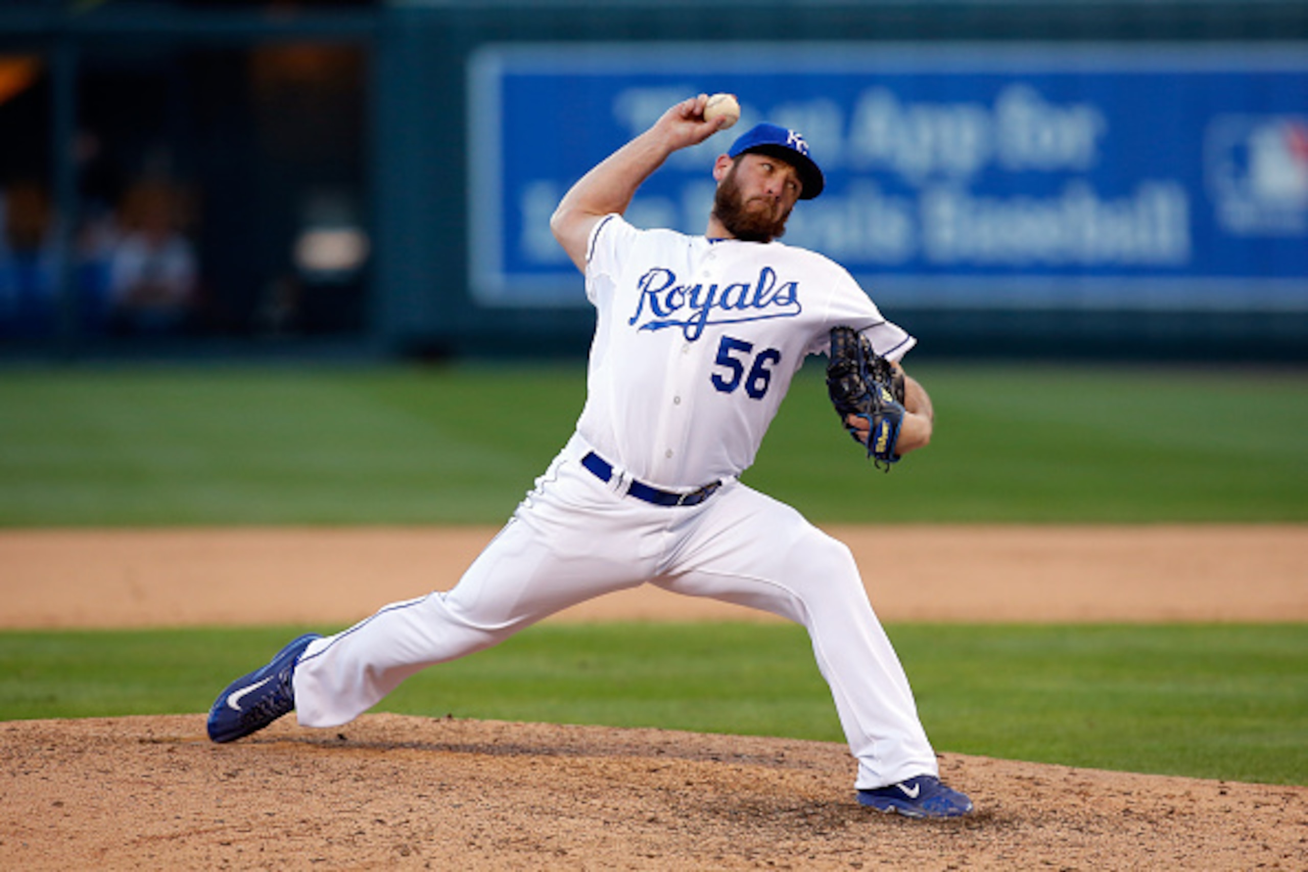 KANSAS CITY, MO - OCTOBER 15:  Greg Holland #56 of the Kansas City Royals throws a pitch in the ninth inning against the Baltimore Orioles during Game Four of the American League Championship Series at Kauffman Stadium on October 15, 2014 in Kansas City, 