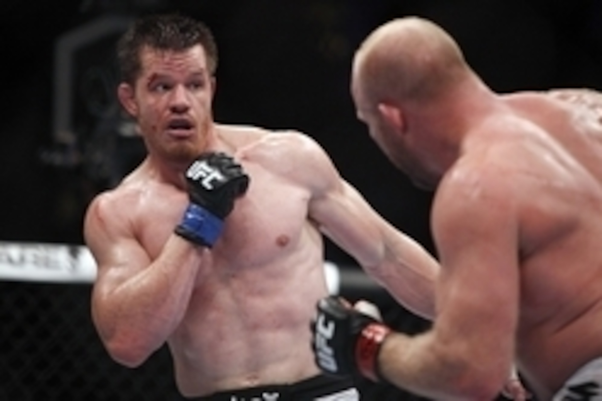 Oct 19, 2013; Houston, TX, USA; Tim Boetsch (red gloves) fights against C.B. Dollaway (blue gloves) in their middleweight bout during UFC 166 at Toyota Center. Mandatory Credit: Andrew Richardson-USA TODAY Sports
