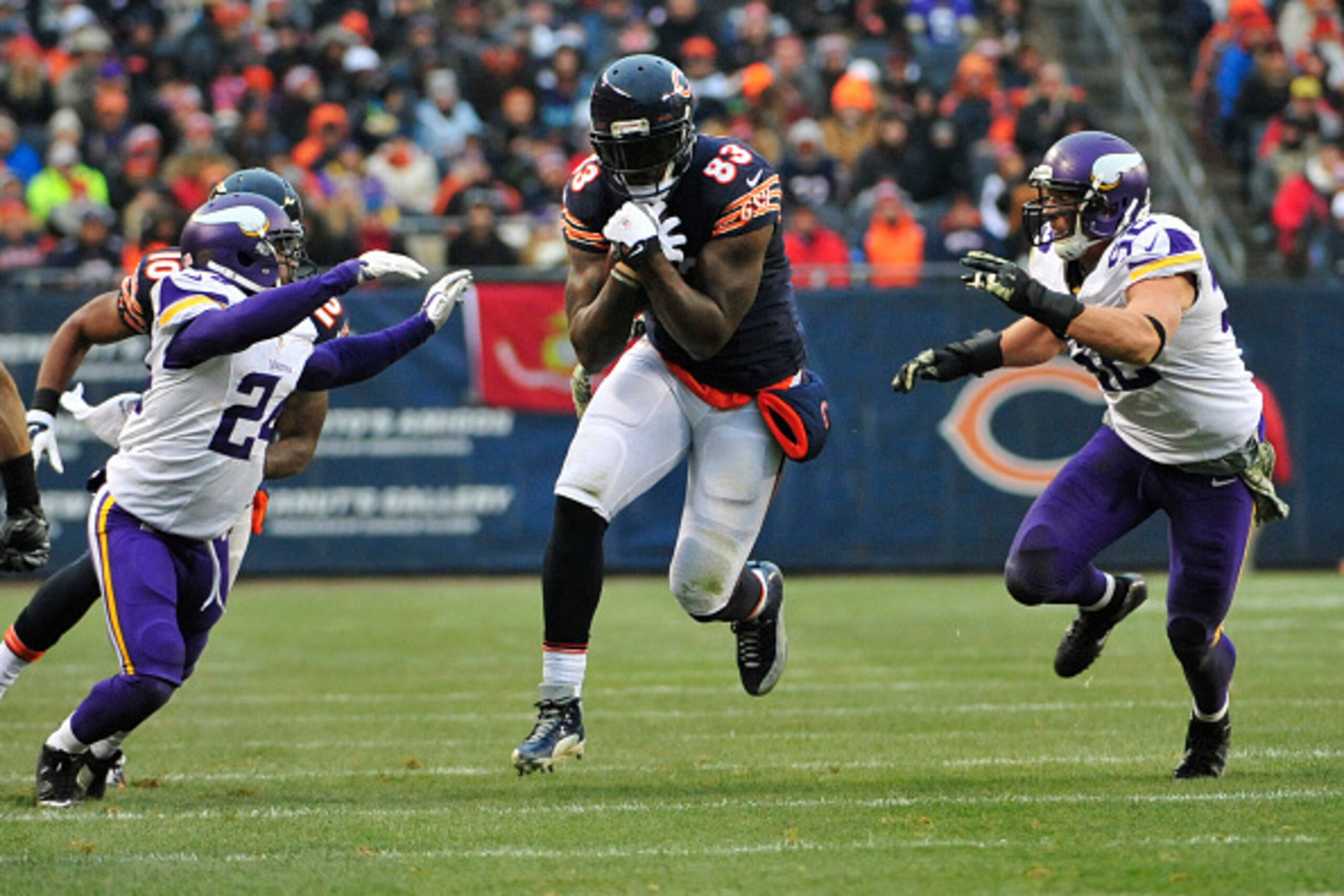 CHICAGO, IL - NOVEMBER 16: Martellus Bennett #83 of the Chicago Bears runs past Captain Munnerlyn #24 of the Minnesota Vikings and Chad Greenway #52 during the third quarter on November 16, 2014 at Soldier Field in Chicago, Illinois. The Chicago Bears def CHICAGO, IL - NOVEMBER 16: Martellus Bennett #83 of the Chicago Bears runs past Captain Munnerlyn #24 of the Minnesota Vikings and Chad Greenway #52 during the third quarter on November 16, 2014 at Soldier Field in Chicago, Illinois. The Chicago Bears def
