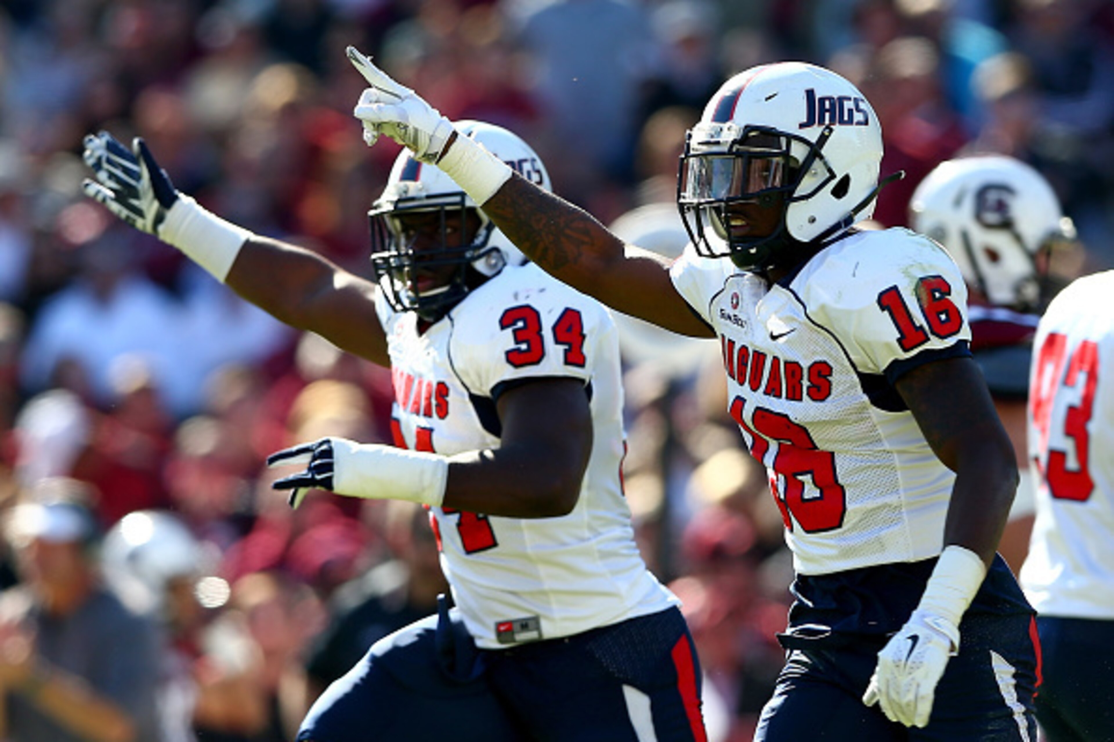 COLUMBIA, SC - NOVEMBER 22:  Teammates Desmond LaVelle #34 and Montell Garner #16 of the South Alabama Jaguars celebrate after recovering a fumble against the South Carolina Gamecocks during their game at Williams-Brice Stadium on November 22, 2014 in Col