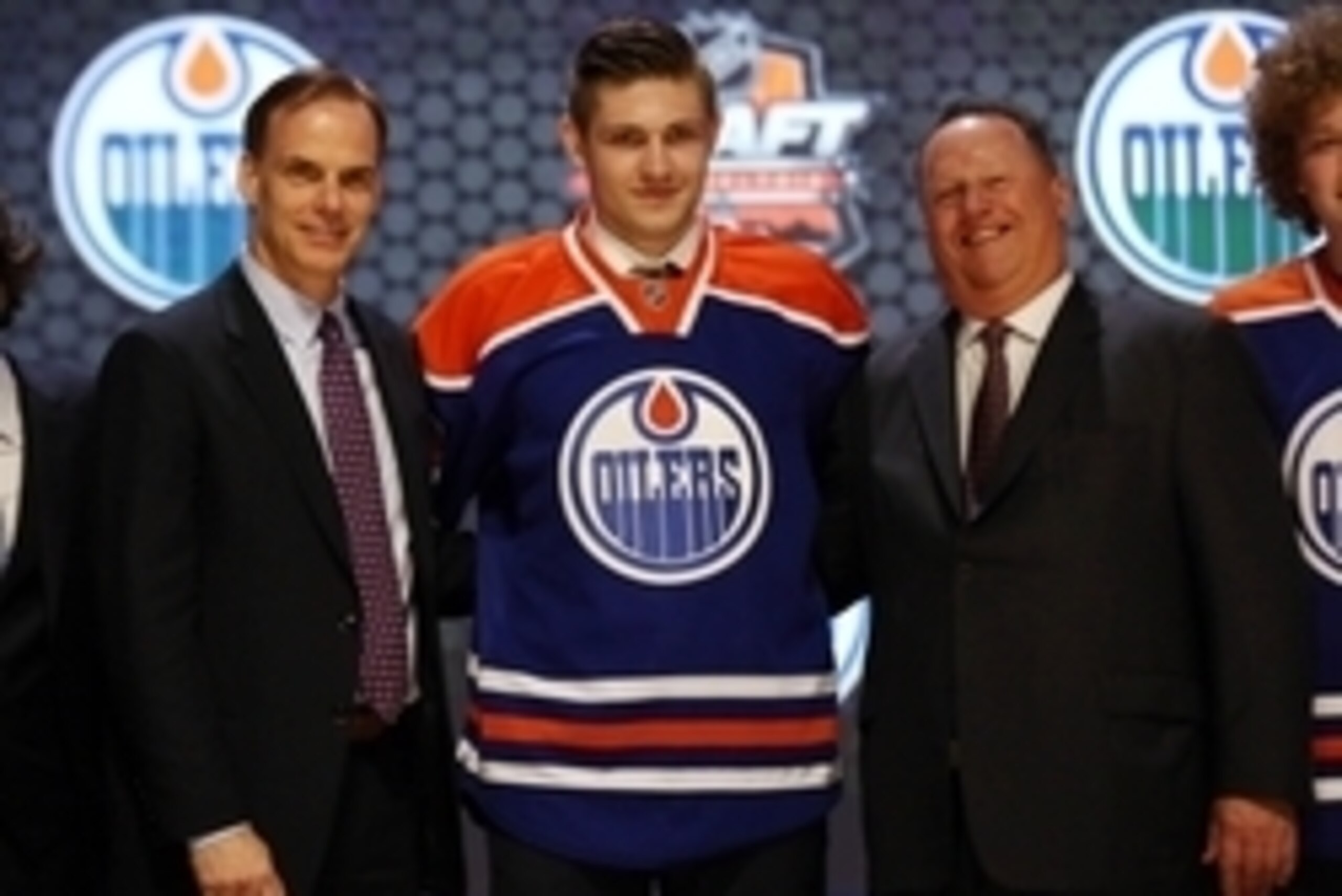 Jun 27, 2014; Philadelphia, PA, USA; Leon Draisaitl poses for a photo with team officials after being selected as the number three overall pick to the Edmonton Oilers in the first round of the 2014 NHL Draft at Wells Fargo Center. Mandatory Credit: Bill S