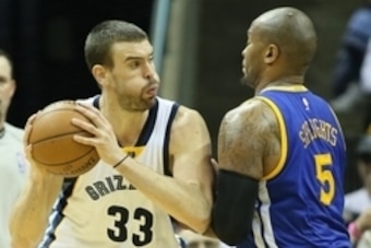 Dec 16, 2014; Memphis, TN, USA; Memphis Grizzlies center Marc Gasol (33) drives against Golden State Warriors forward Marreese Speights (5) at FedExForum. Grizzlies defeated the Warriors 105-98. Mandatory Credit: Nelson Chenault-USA TODAY Sports