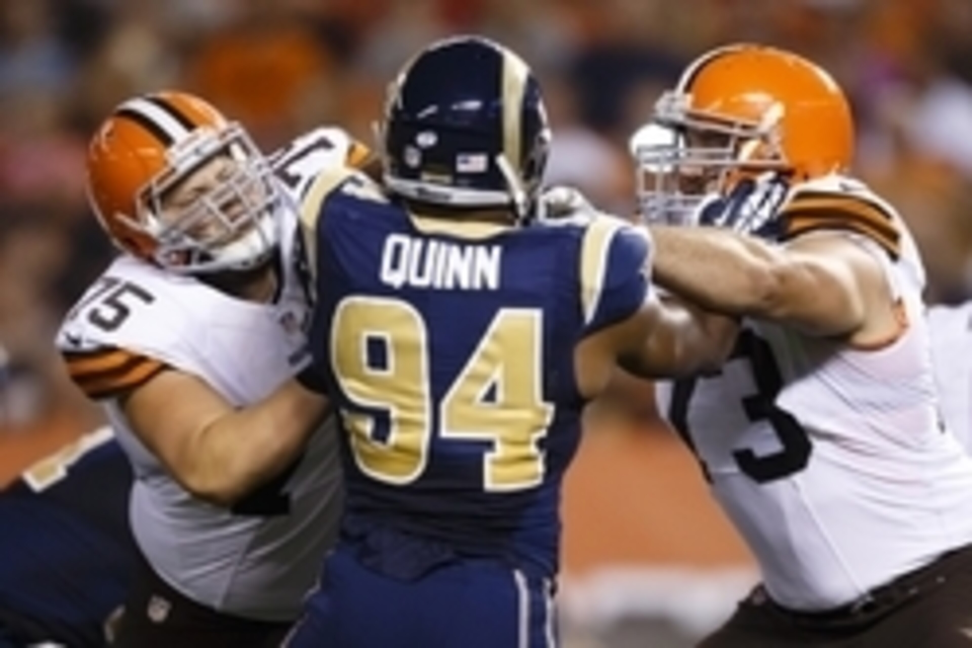 Aug 23, 2014; Cleveland, OH, USA; Cleveland Browns offensive tackle Joel Bitonio (75) and tackle Joe Thomas (73) block St. Louis Rams defensive end Robert Quinn (94) in the second quarter at FirstEnergy Stadium. Mandatory Credit: Rick Osentoski-USA TODAY 