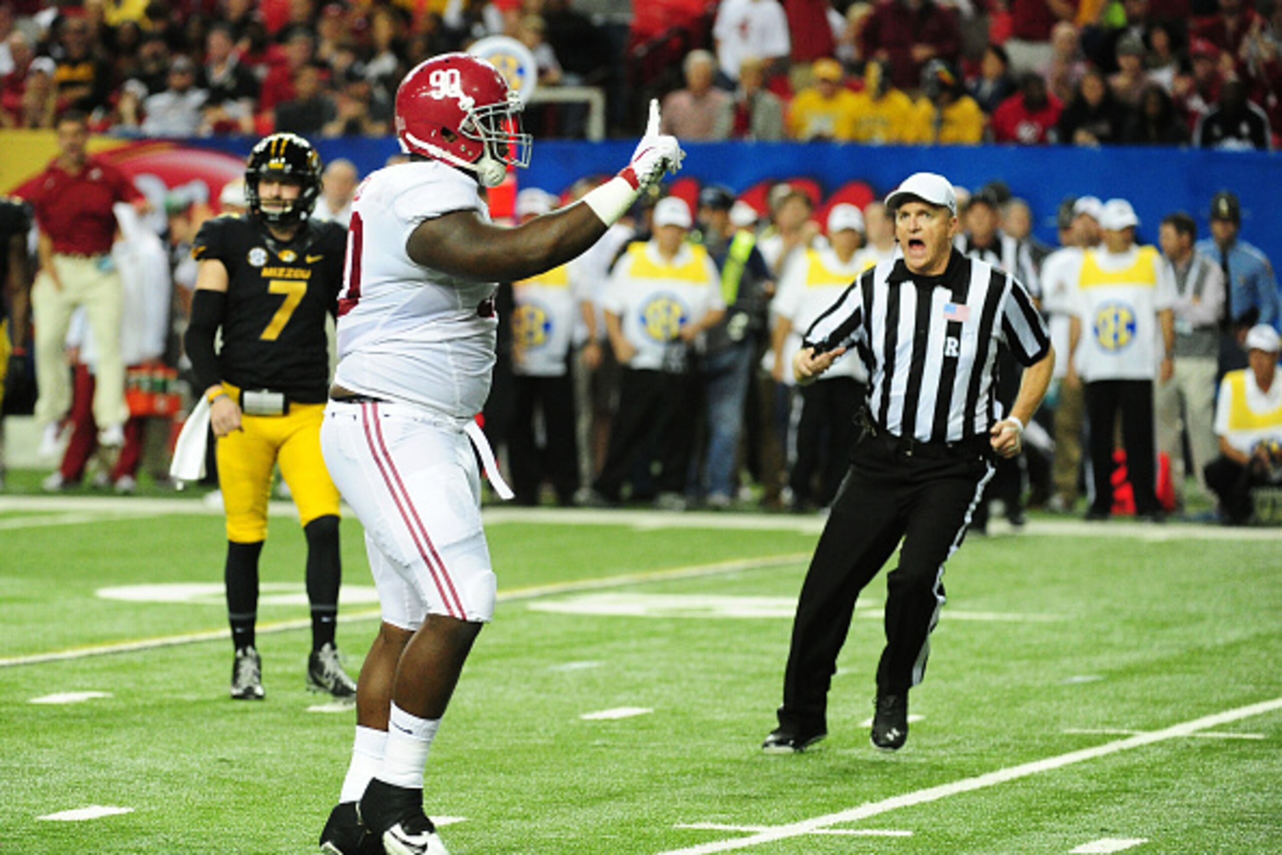 ATLANTA, GA - DECEMBER 06:  Jarran Reed #90 of the Alabama Crimson Tide celebrates a stop against the Missouri Tigers in the first quarter of the SEC Championship game at the Georgia Dome on December 6, 2014 in Atlanta, Georgia.  (Photo by Scott Cunningha