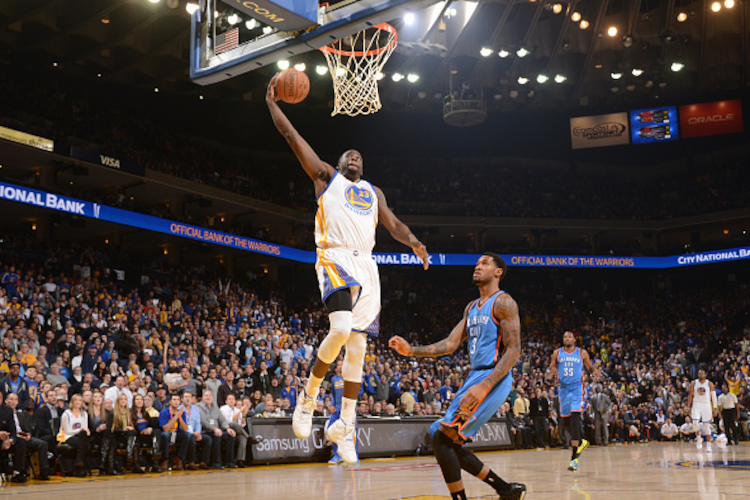 OAKLAND, CA - DECEMBER 18: Draymond Green #23 of the Golden State Warriors goes up for a dunk against the Oklahoma City Thunder on December 18, 2014 at Oracle Arena in Oakland, California. NOTE TO USER: User expressly acknowledges and agrees that, by down OAKLAND, CA - DECEMBER 18: Draymond Green #23 of the Golden State Warriors goes up for a dunk against the Oklahoma City Thunder on December 18, 2014 at Oracle Arena in Oakland, California. NOTE TO USER: User expressly acknowledges and agrees that, by down