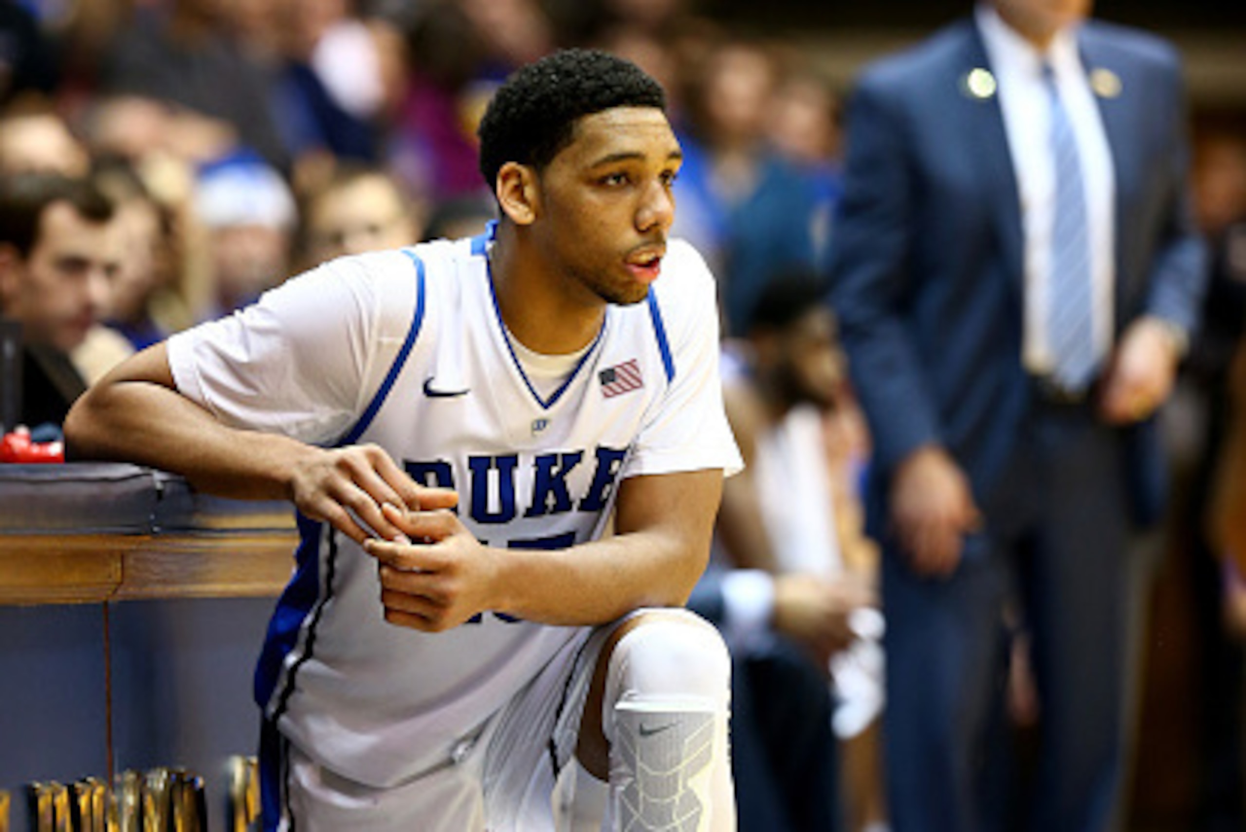 DURHAM, NC - DECEMBER 15:  Jahlil Okafor #15 of the Duke Blue Devils waits to go in the game in front of head coach Mike Krzyzewski during their game against the Elon Phoenix at Cameron Indoor Stadium on December 15, 2014 in Durham, North Carolina.  (Phot