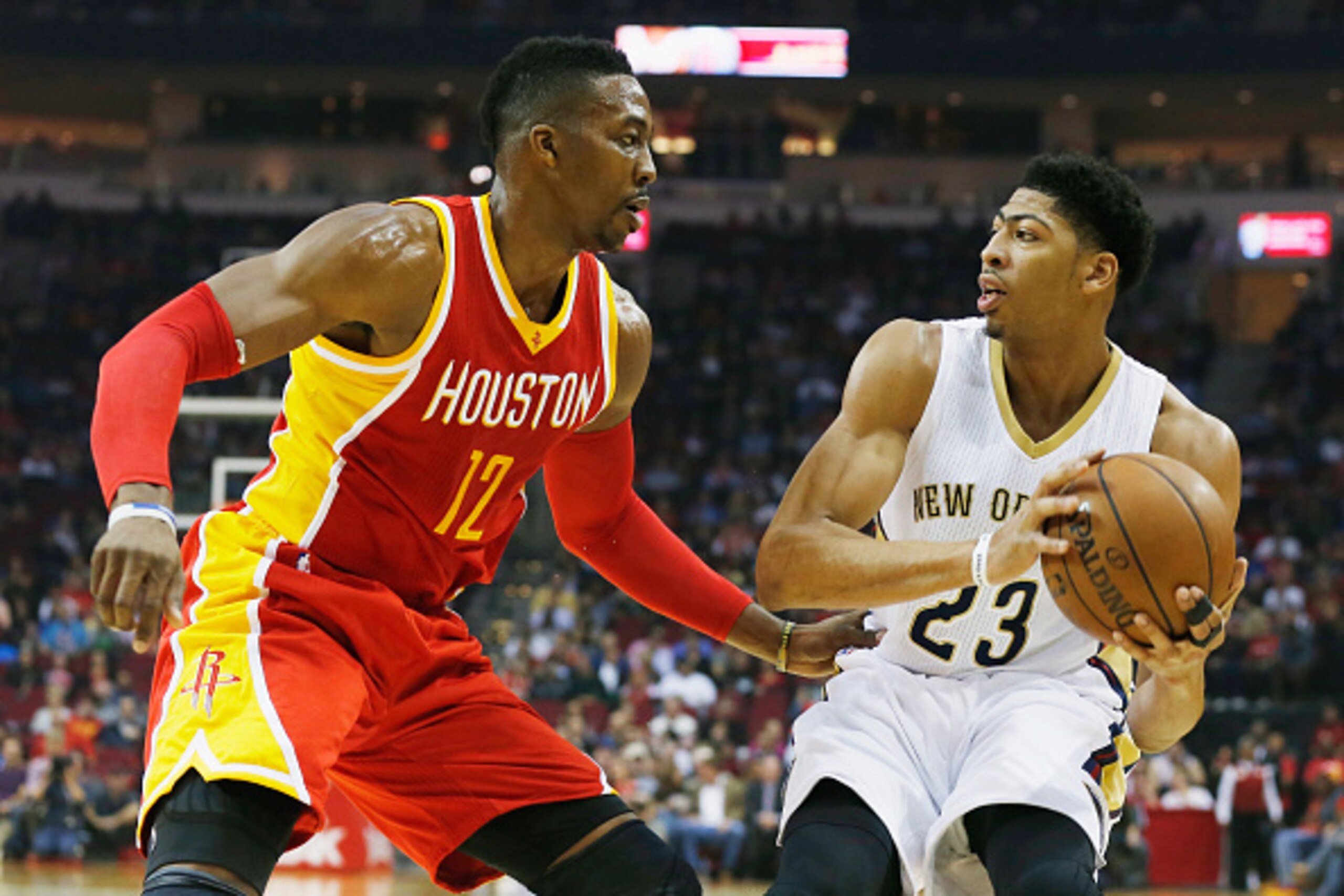 HOUSTON, TX - DECEMBER 18:  HOUSTON, TX - DECEMBER18:  Dwight Howard #12 of the Houston Rockets defends against Anthony Davis #23 of the New Orleans Pelicans during their game at the Toyota Center on December18, 2014 in Houston, Texas.  NOTE TO USER: User