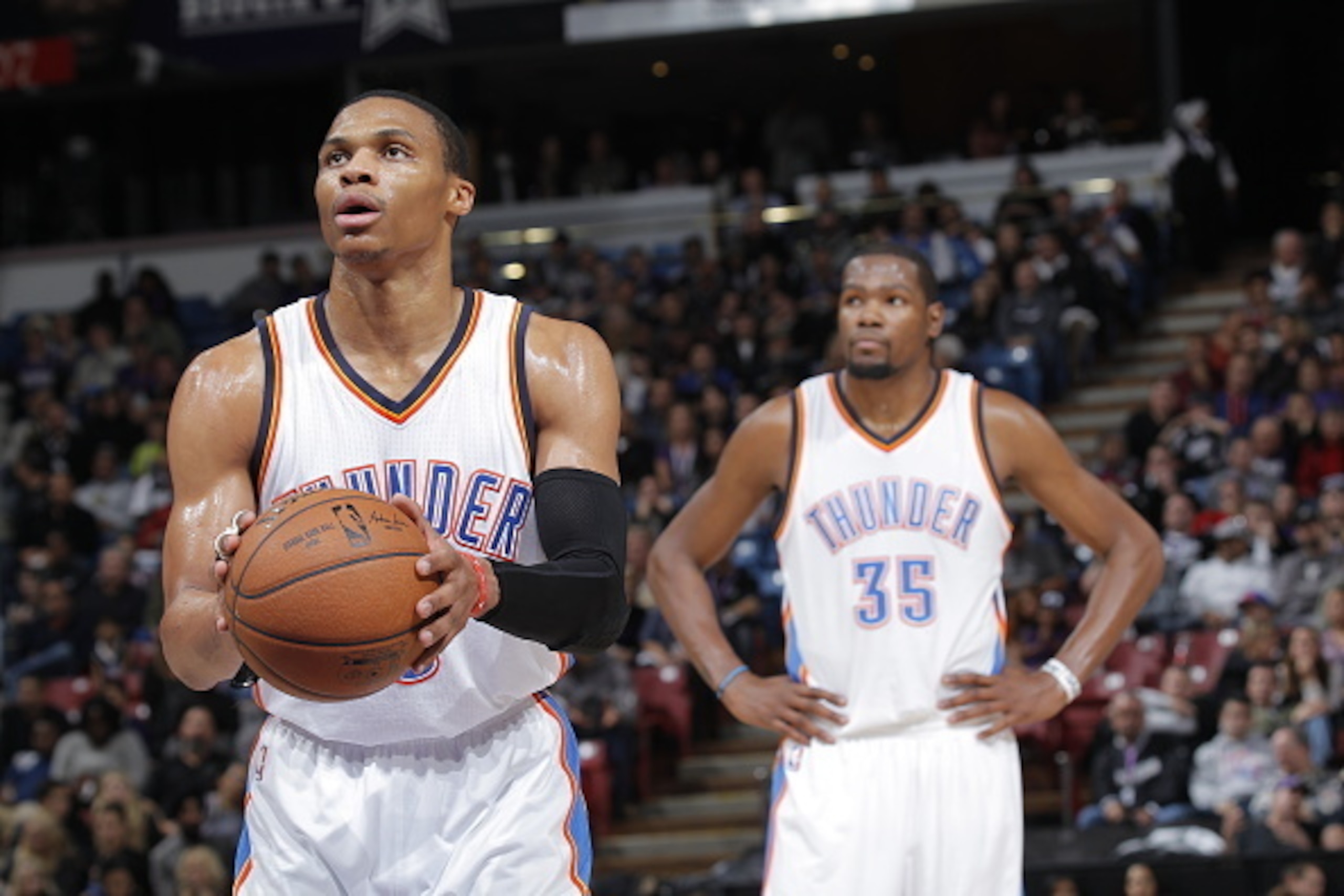 SACRAMENTO, CA - DECEMBER 16:  Russell Westbrook #0 and Kevin Durant #35 take on the Sacramento Kings at Sleep Train Arena on December 16, 2014 in Sacramento, California. NOTE TO USER: User expressly acknowledges and agrees that, by downloading and or usi