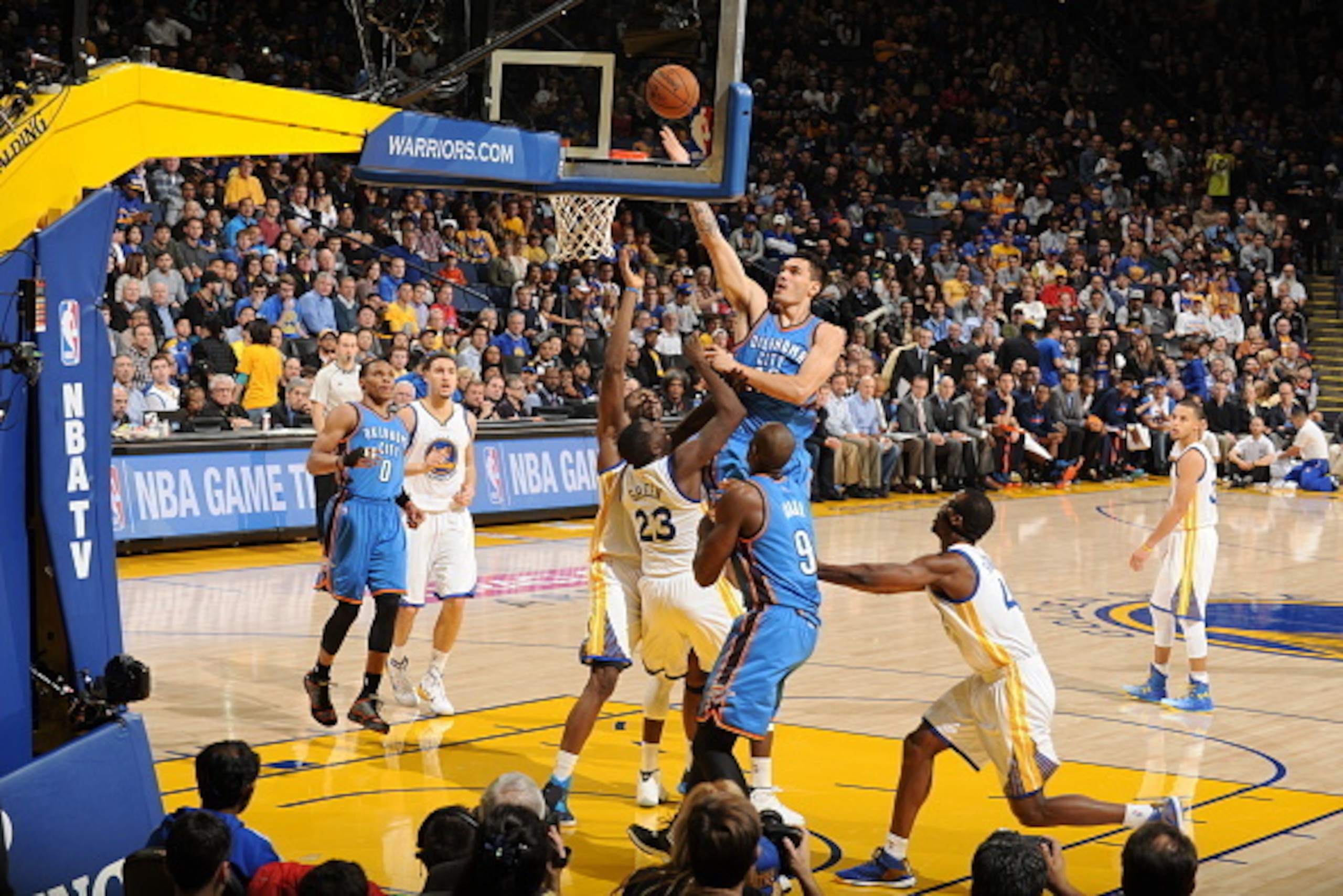 OAKLAND, CA - DECEMBER 18: Steven Adams #12 of the Oklahoma City Thunder shoots against the Golden State Warriors on December 18, 2014 at Oracle Arena in Oakland, California. NOTE TO USER: User expressly acknowledges and agrees that, by downloading and or OAKLAND, CA - DECEMBER 18: Steven Adams #12 of the Oklahoma City Thunder shoots against the Golden State Warriors on December 18, 2014 at Oracle Arena in Oakland, California. NOTE TO USER: User expressly acknowledges and agrees that, by downloading and or
