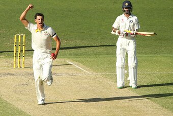 BRISBANE, AUSTRALIA - DECEMBER 19:  Mitchell Starc of Australia celebrates after dismissing Murali Vijay of India during day three of the 2nd Test match between Australia and India at The Gabba on December 19, 2014 in Brisbane, Australia.  (Photo by Chris