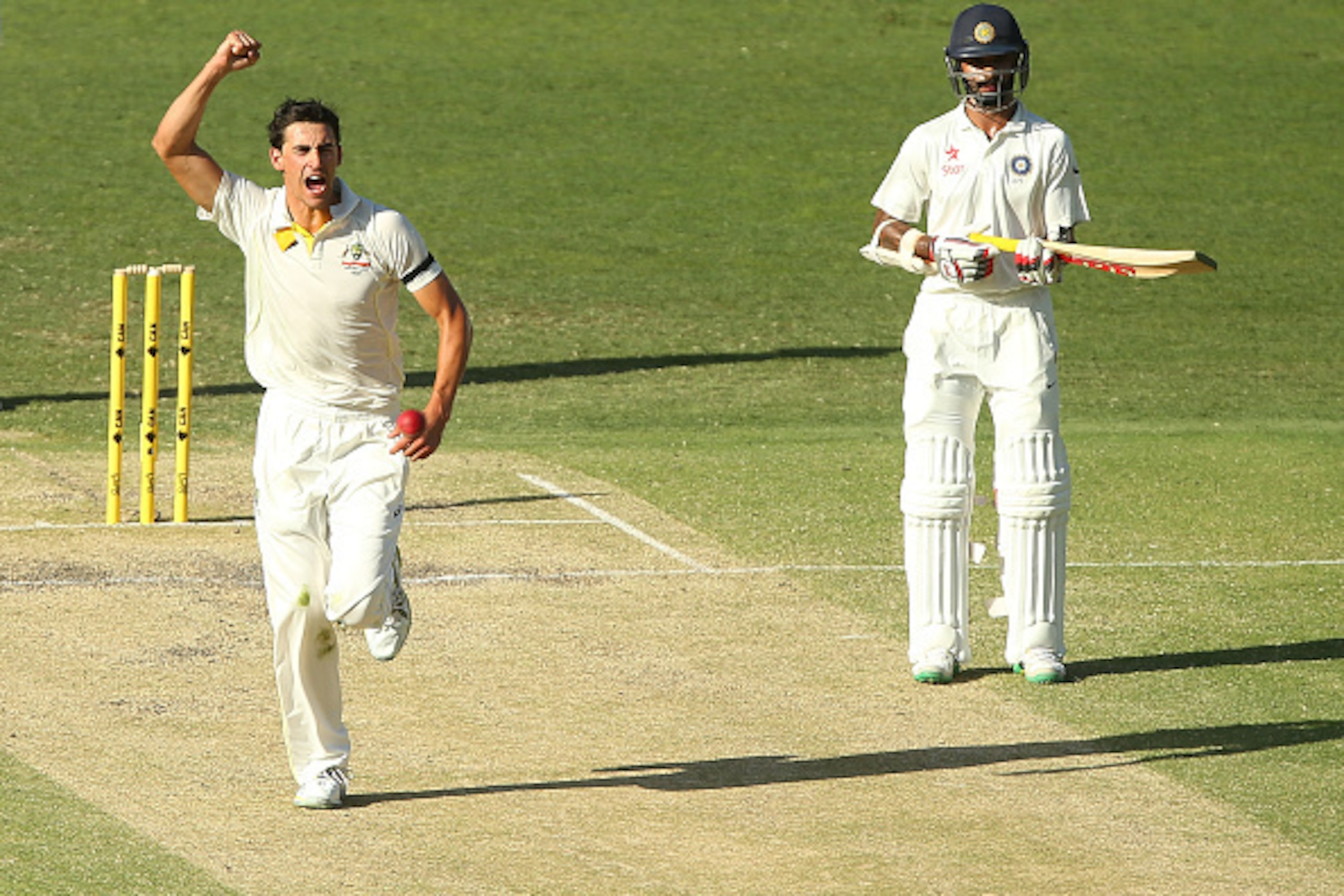 BRISBANE, AUSTRALIA - DECEMBER 19:  Mitchell Starc of Australia celebrates after dismissing Murali Vijay of India during day three of the 2nd Test match between Australia and India at The Gabba on December 19, 2014 in Brisbane, Australia.  (Photo by Chris