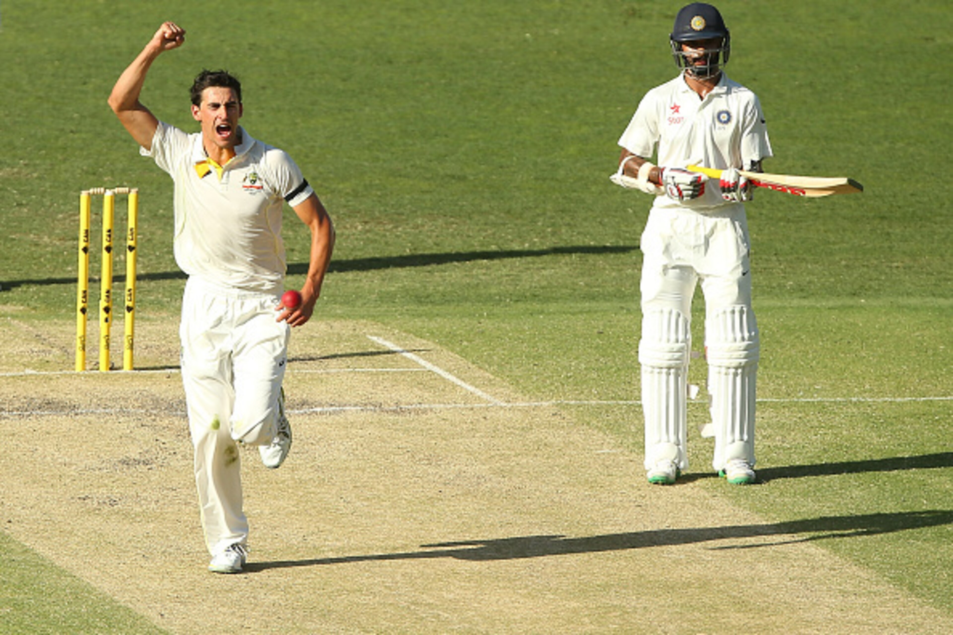 BRISBANE, AUSTRALIA - DECEMBER 19:  Mitchell Starc of Australia celebrates after dismissing Murali Vijay of India during day three of the 2nd Test match between Australia and India at The Gabba on December 19, 2014 in Brisbane, Australia.  (Photo by Chris