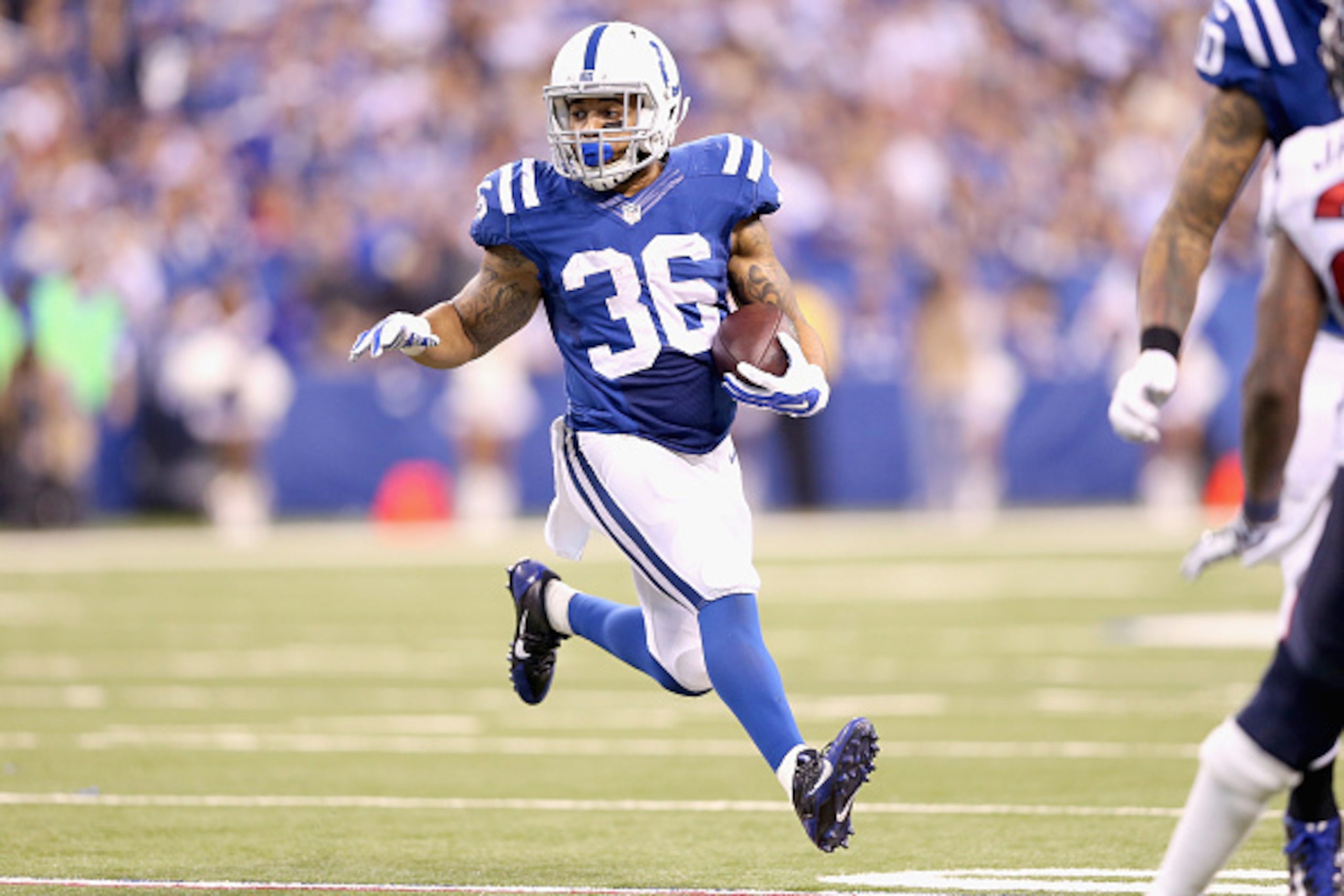 INDIANAPOLIS, IN - DECEMBER 14:  Daniel Herron #36 of the Indianapolis Colts runs with the ball during the game against the Houston Texans at Lucas Oil Stadium on December 14, 2014 in Indianapolis, Indiana.  The Colts won 17-10.  (Photo by Andy Lyons/Gett