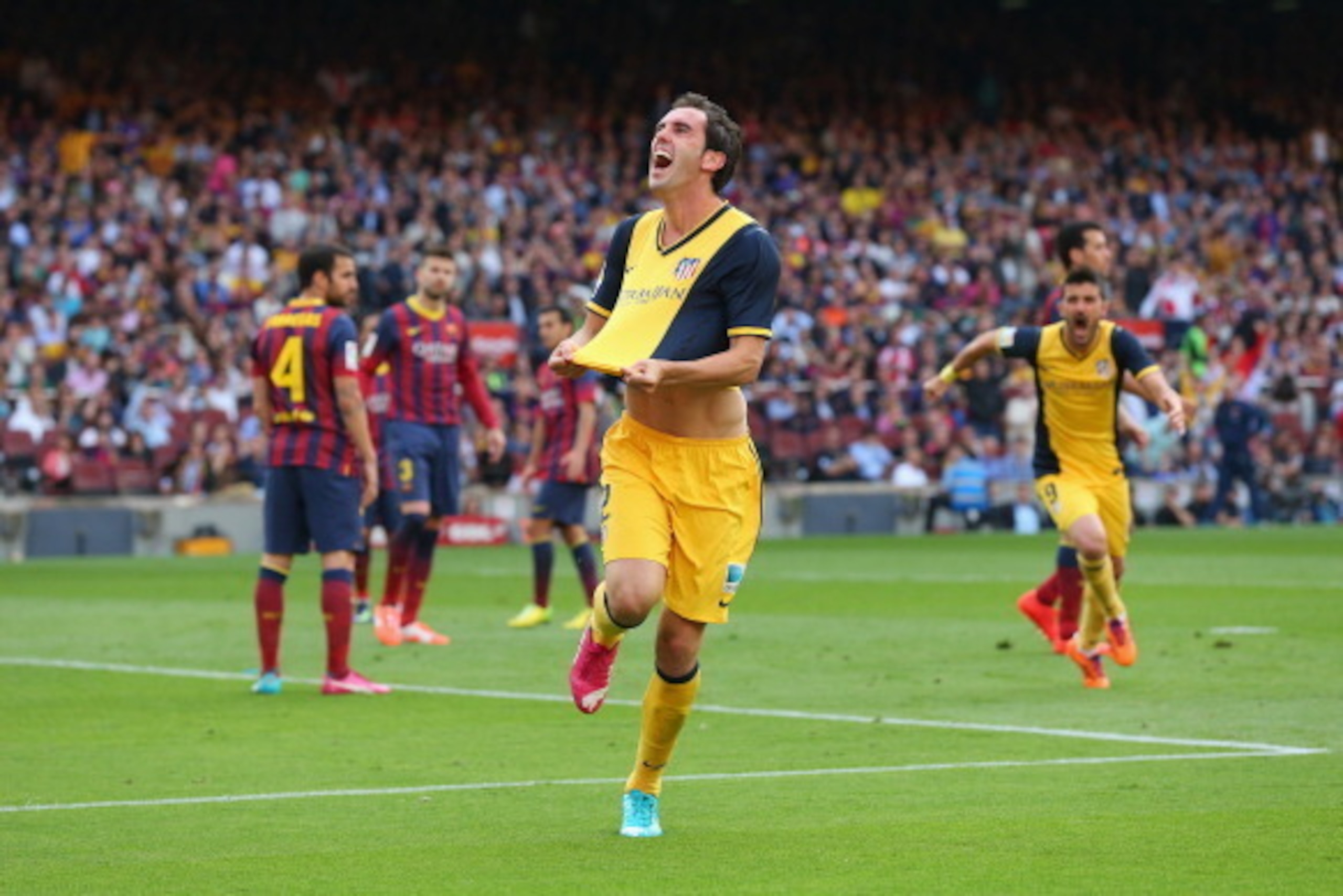 BARCELONA, SPAIN - MAY 17:  Diego Godin of Club Atletico de Madrid celebrates after scoring his goal during the La Liga match between FC Barcelona and Club Atletico de Madrid at Camp Nou on May 17, 2014 in Barcelona, Spain.  (Photo by Alex Livesey/Getty I