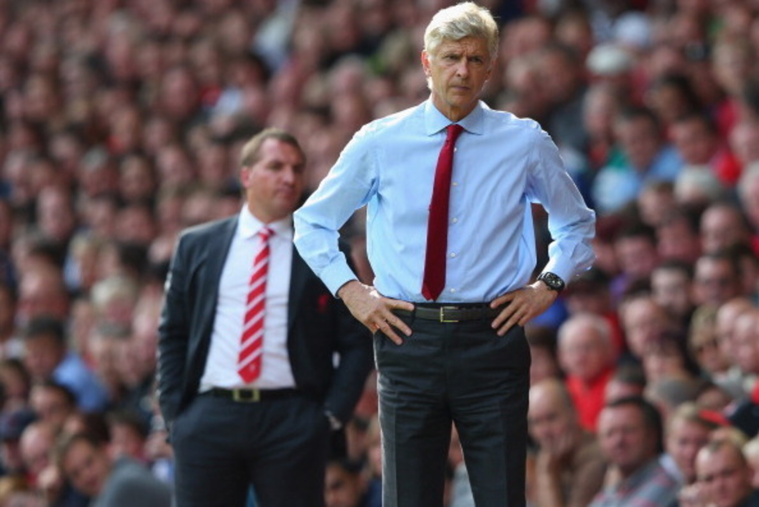 LIVERPOOL, ENGLAND - SEPTEMBER 02:  Arsene Wenger the manager of Arsenal and Brendan Rodgers the manager of Liverpool look on during the Barclays Premier League match between Liverpool and  Arsenal at Anfield on September 2, 2012 in Liverpool, England.  (
